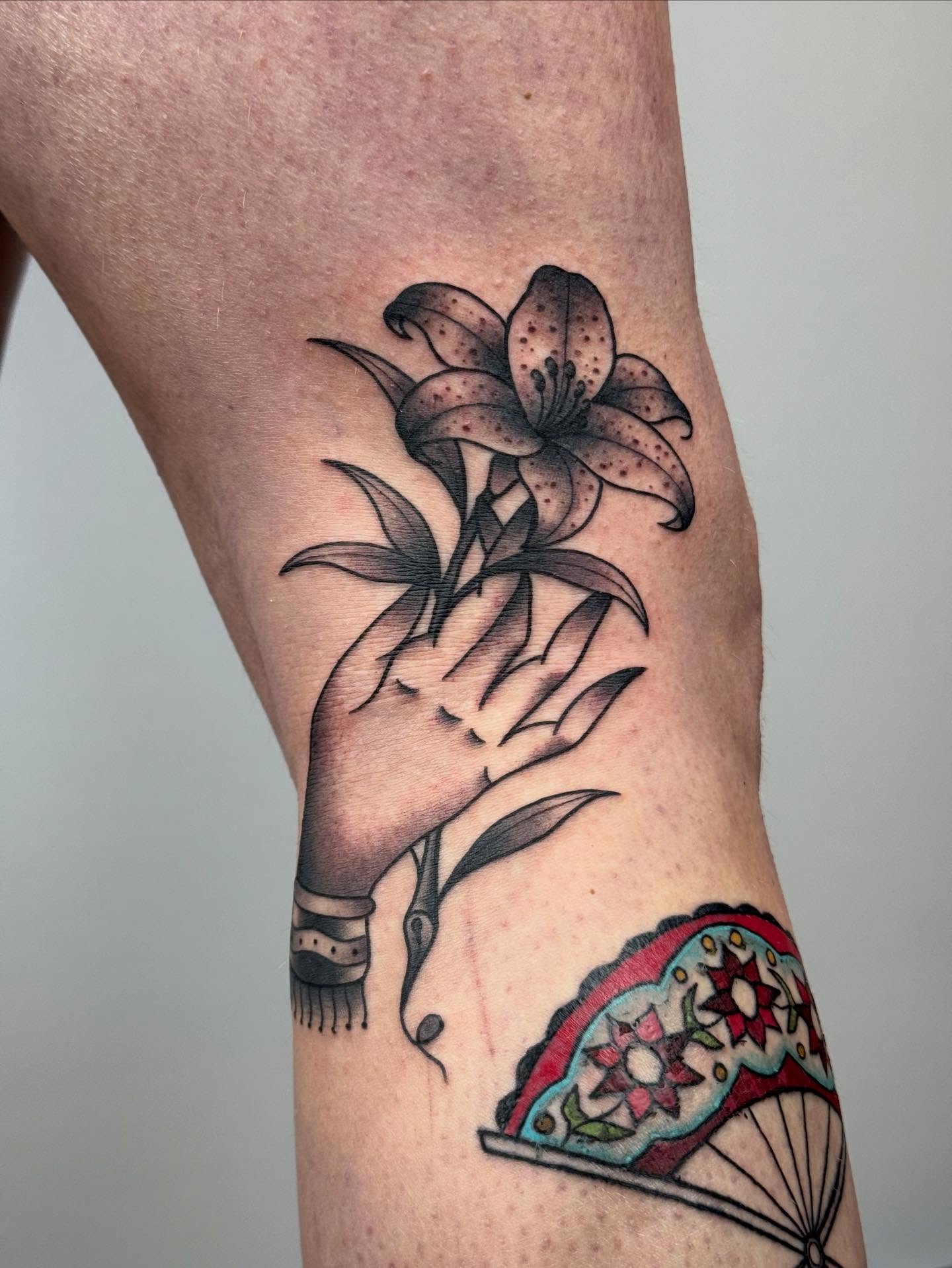 Lily black and grey tattoo on the forearm by π©πͺπ¬