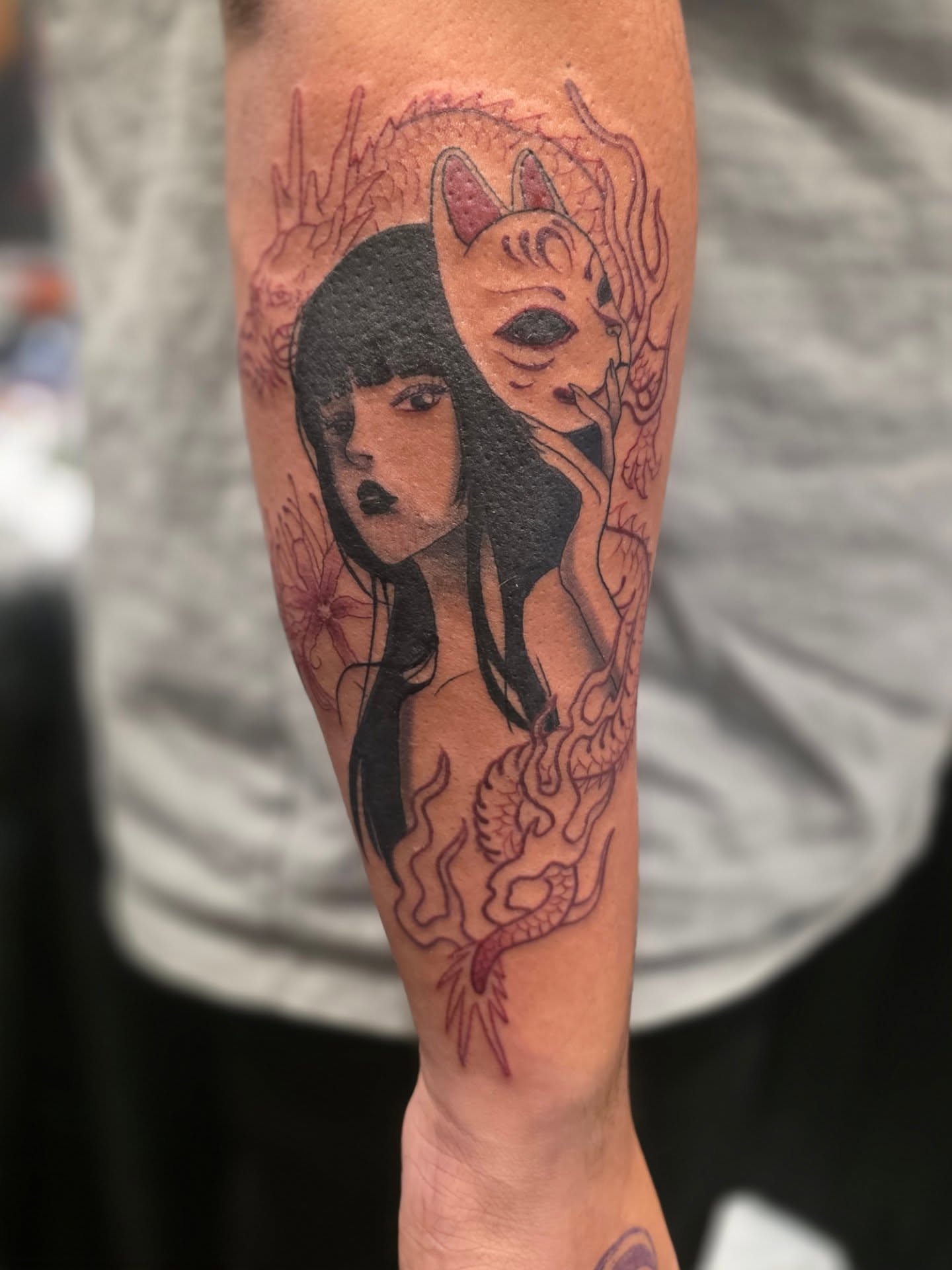 Woman with fox mask anime tattoo on the forearm by Claudia Isabel Roman, El Paso, Texas