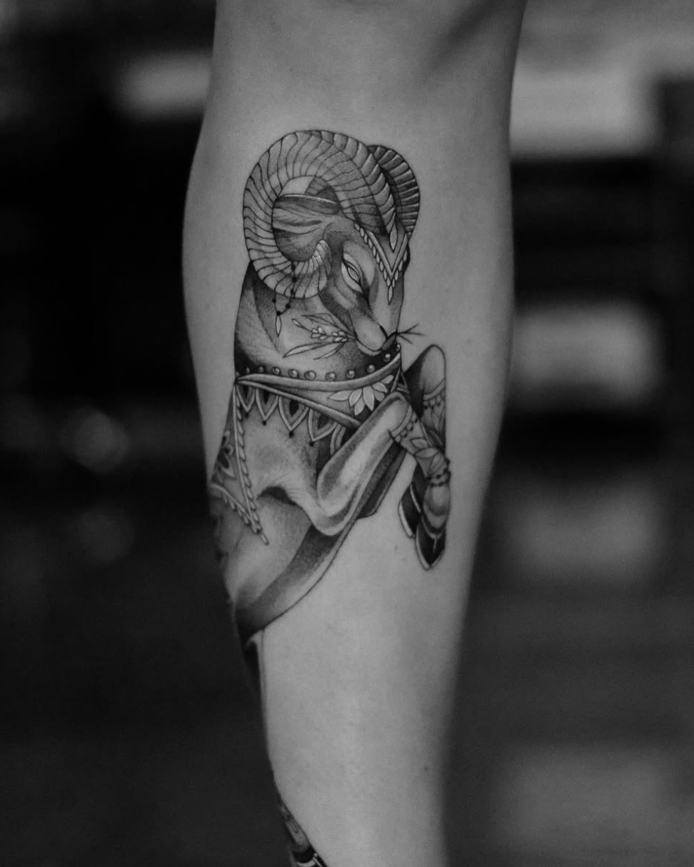 Ram with attire black and grey tattoo on the forearm by Isabelle Kellar, San Diego, California