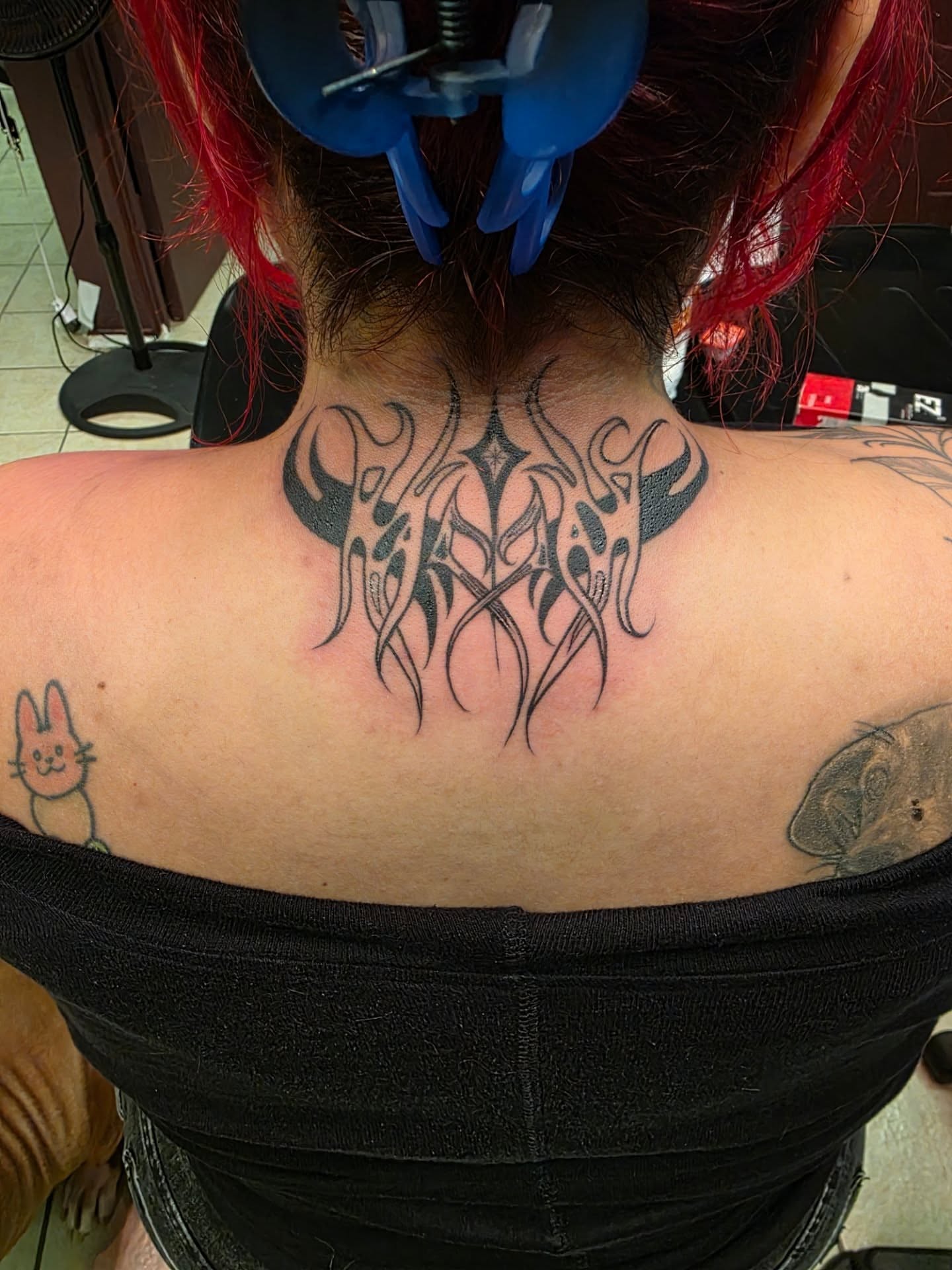 Tribal design tribal tattoo on the back by Claudia Isabel Roman, El Paso, Texas