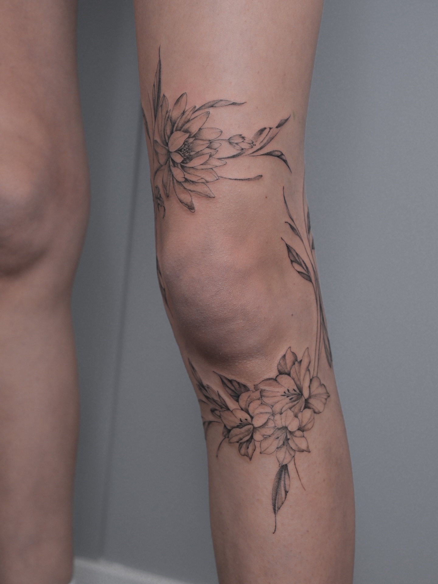 Floral arrangement black and grey tattoo on the forearm by Alina 🌙 Tattoo in Calgary 🇨🇦