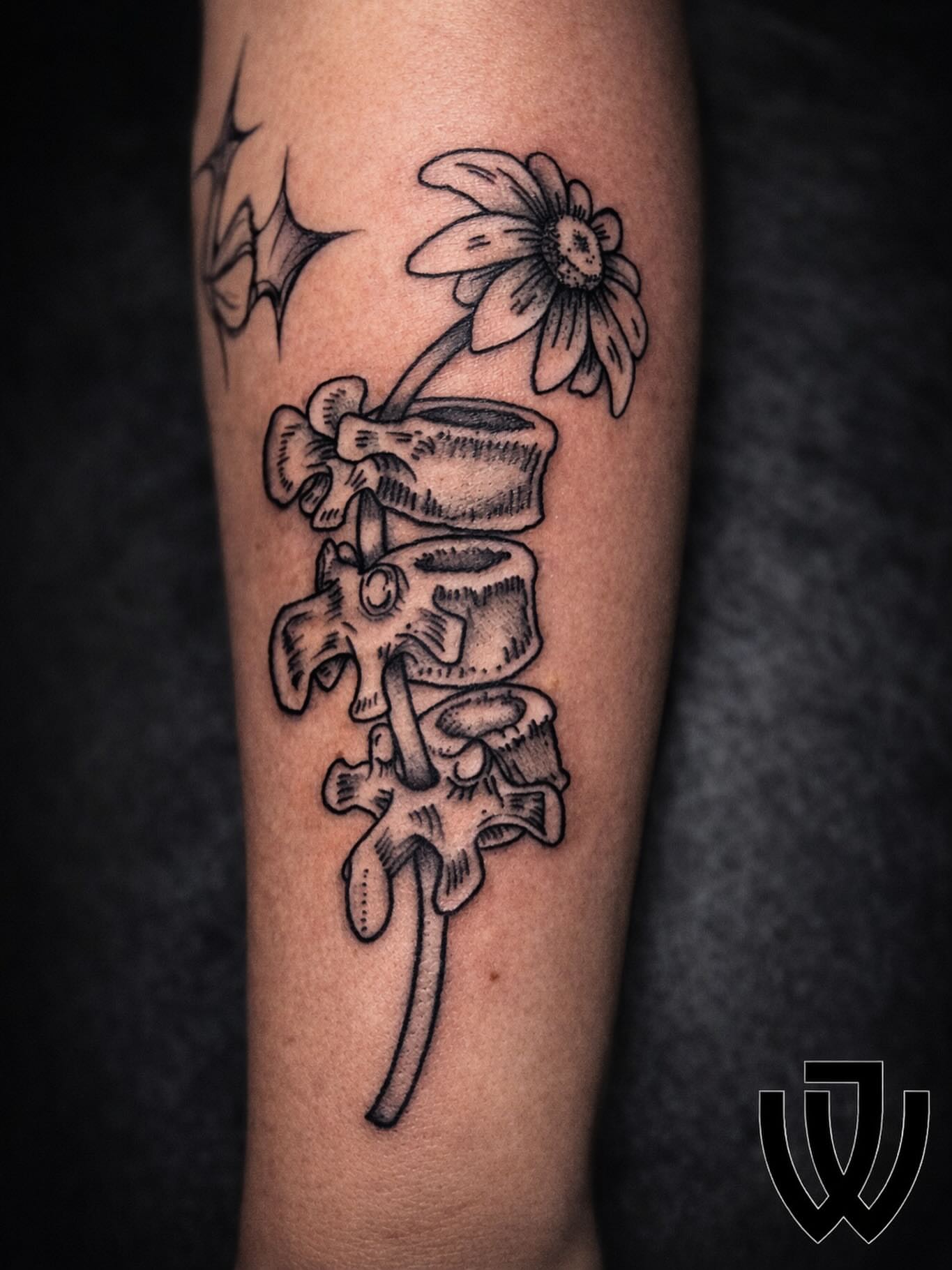 Spine and flower black and grey tattoo on the forearm by Joshua Ware, Alvarado, Texas
