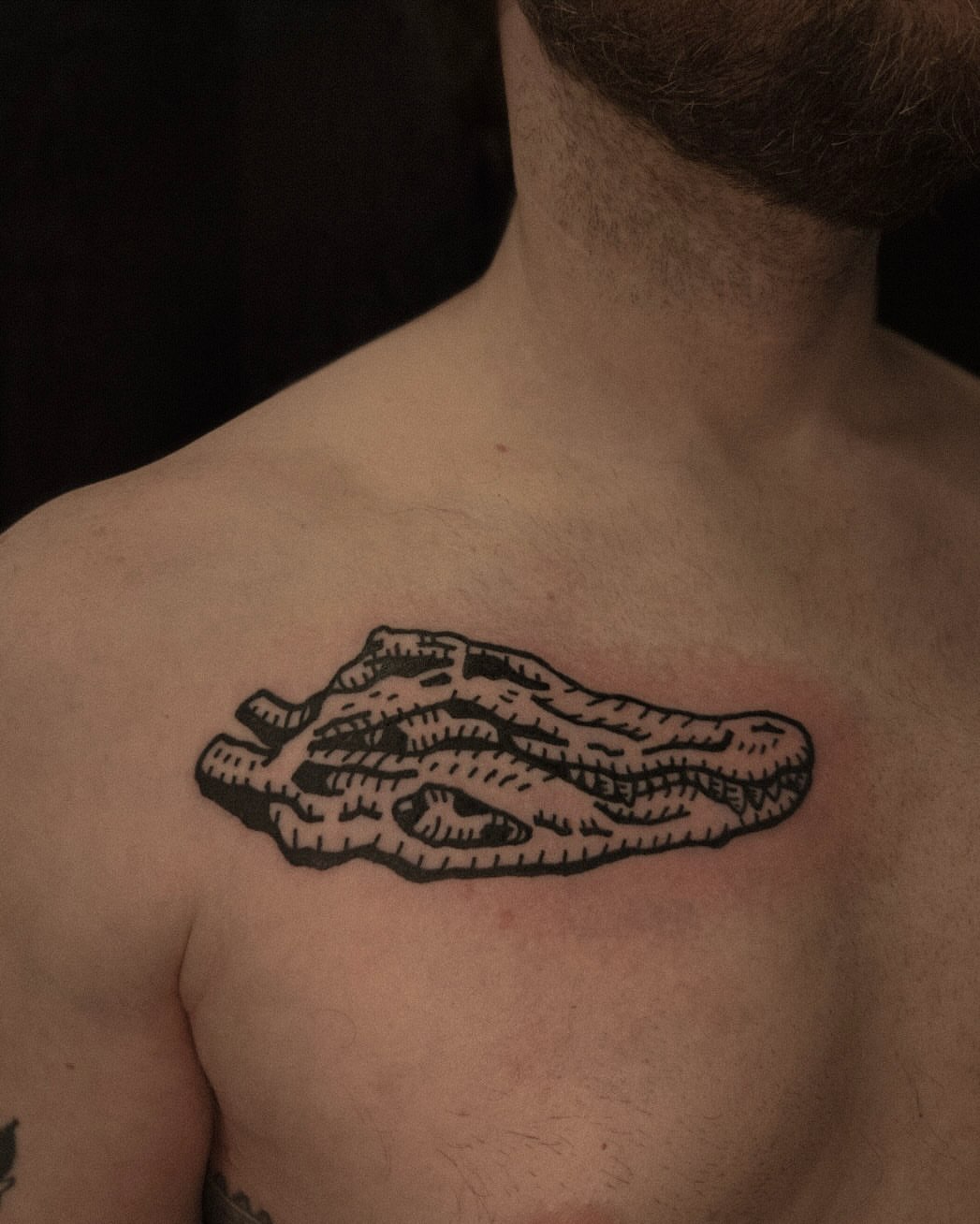 Bacon black and grey tattoo on the chest by ashley blyght