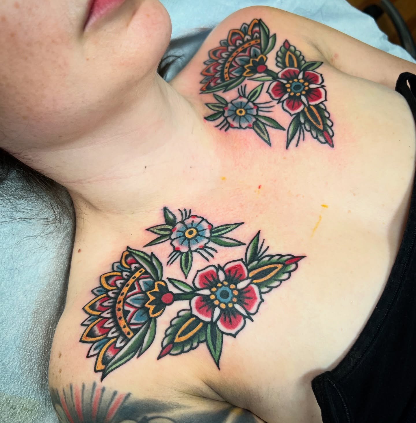 Floral arrangement American traditional tattoo on the chest by Shannon Pagliarini
