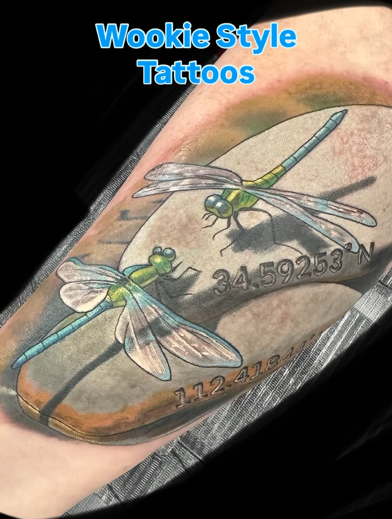 Dragonflies realism tattoo on the forearm by KJ