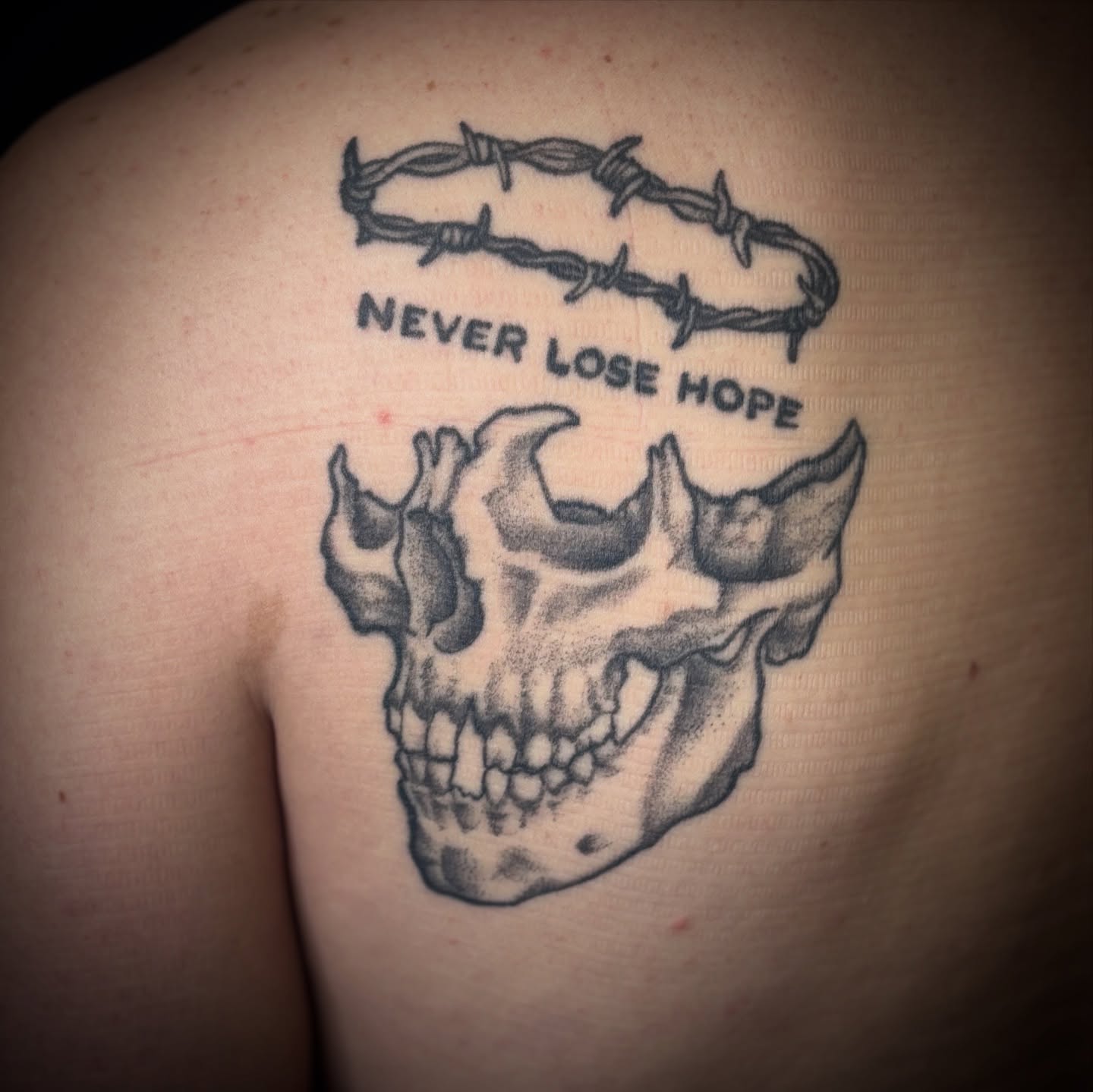 Barbed wire crown dotwork tattoo on the shoulder by Noah Blum