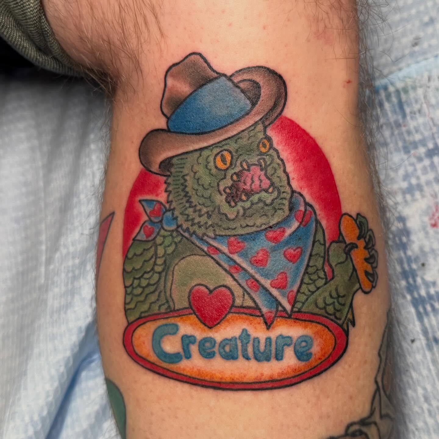 Monster with cowboy hat American traditional tattoo on the forearm by Sue Garcia