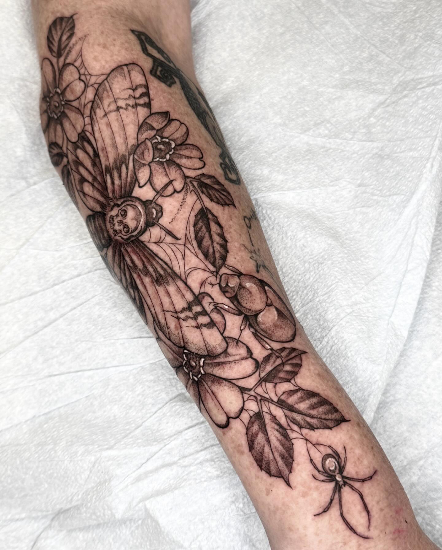 Flower and skull black and grey tattoo on the forearm by 🌸delaney🌸