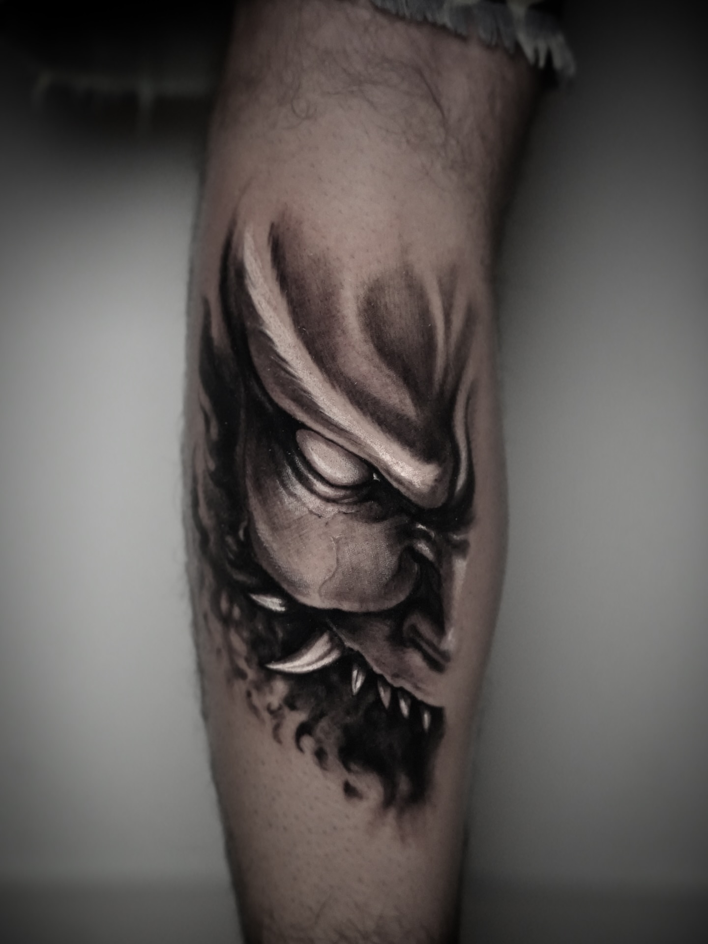 Demon face dark realism tattoo on the forearm by Xavi Xiva TATTOO