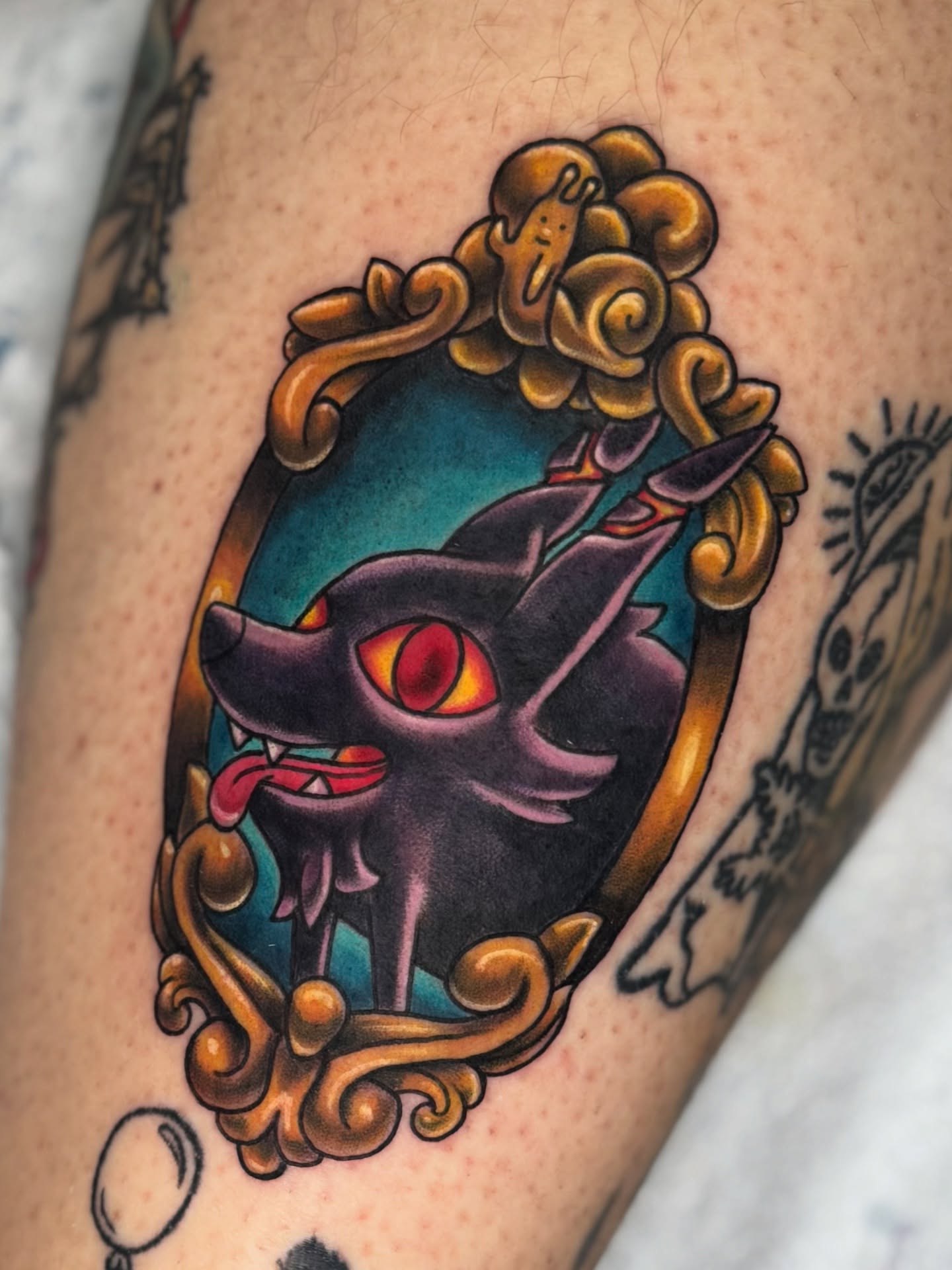 Cat in mirror American traditional tattoo on the forearm by Breanna B