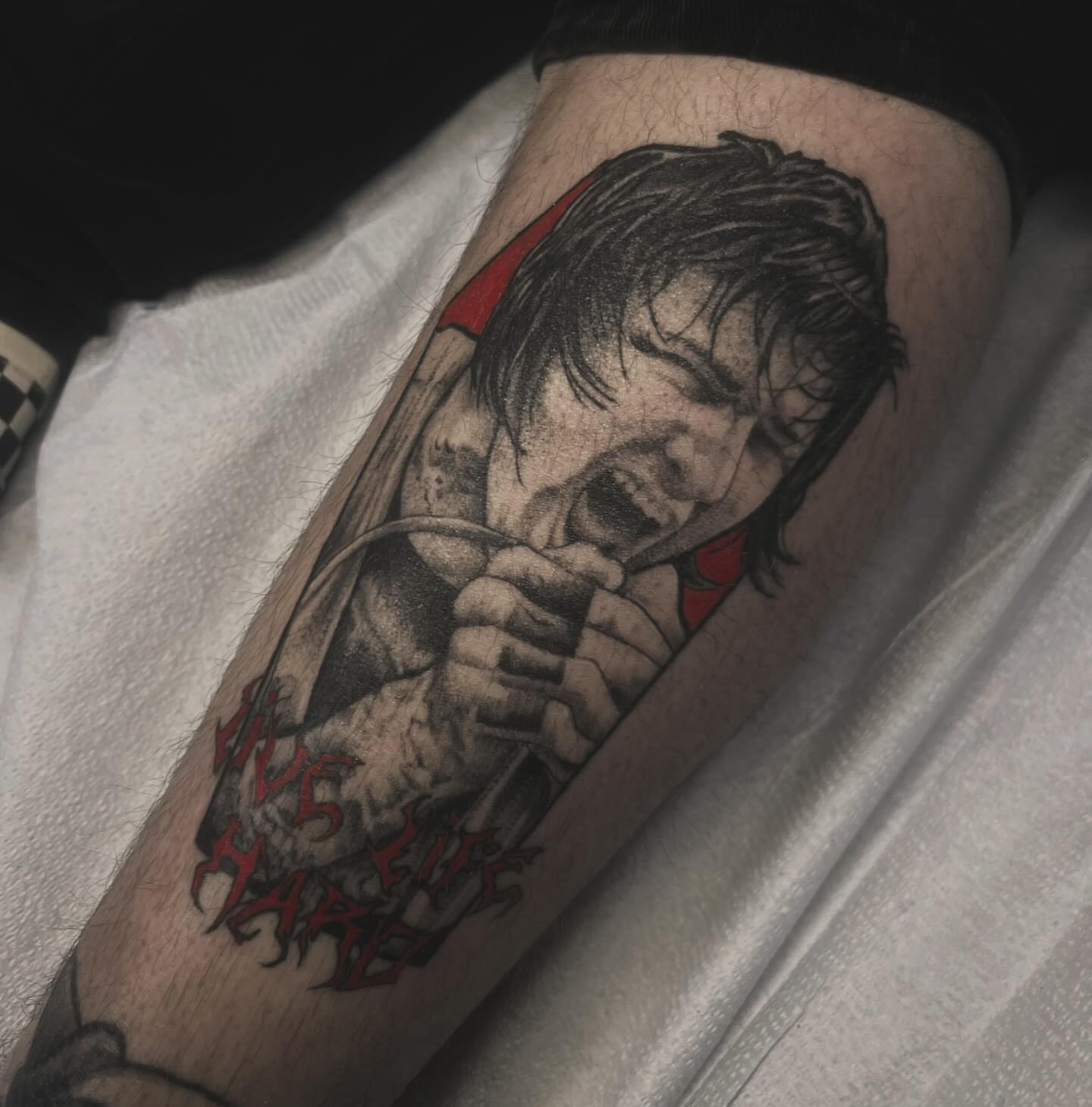 Man with bow realism tattoo on the forearm by Sarah Foltz