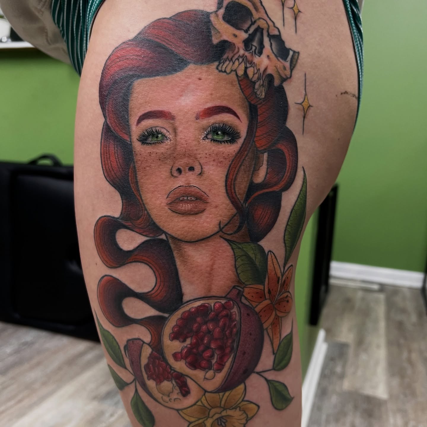 Woman with pomegranate American traditional tattoo on the thigh by Olivia Suzanne Fada