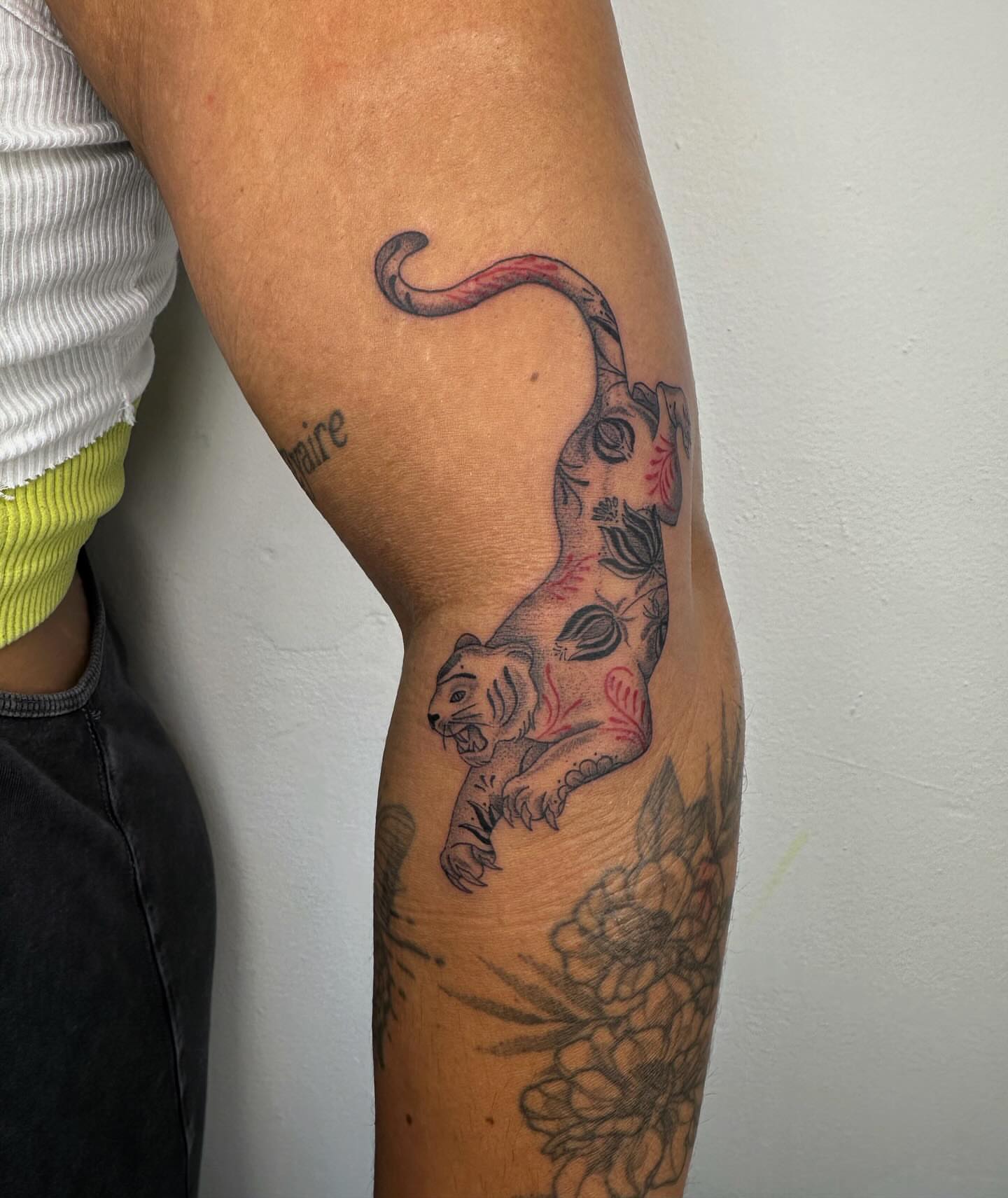 Panther and flowers new school tattoo on the forearm by J Valentin