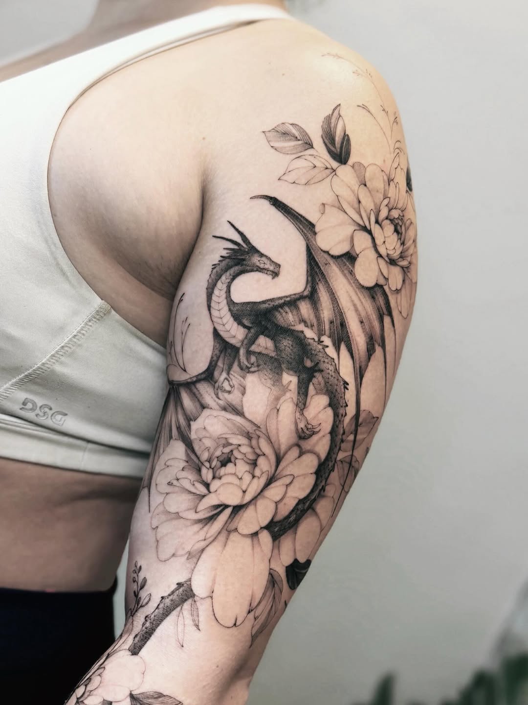 Tattoo by @angel.flow144 — black_and_grey, realism