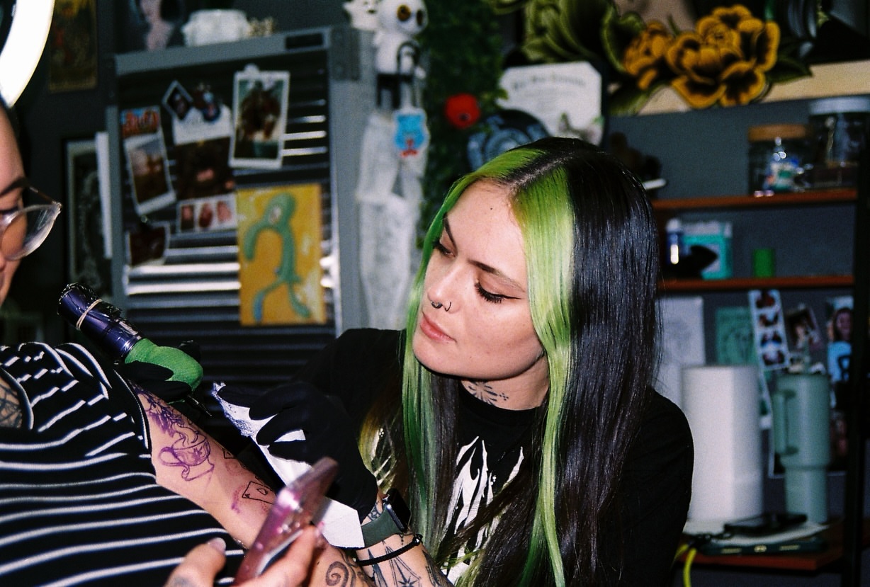 Purple floral design new school tattoo on the forearm by hannah vertal