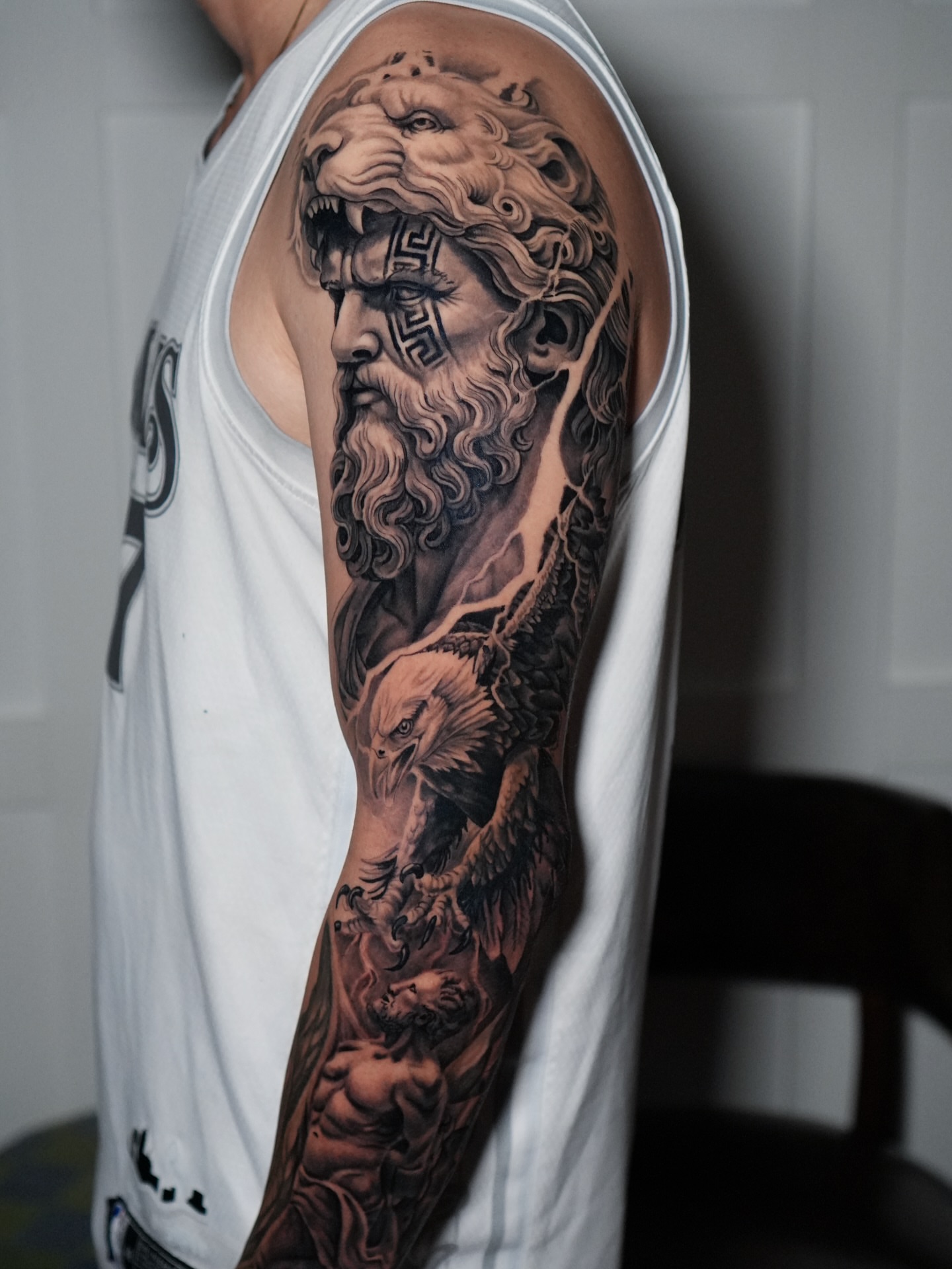 God-like figure with eagle realism tattoo on the upper arm by Drex - Dallas Tattoo Artist