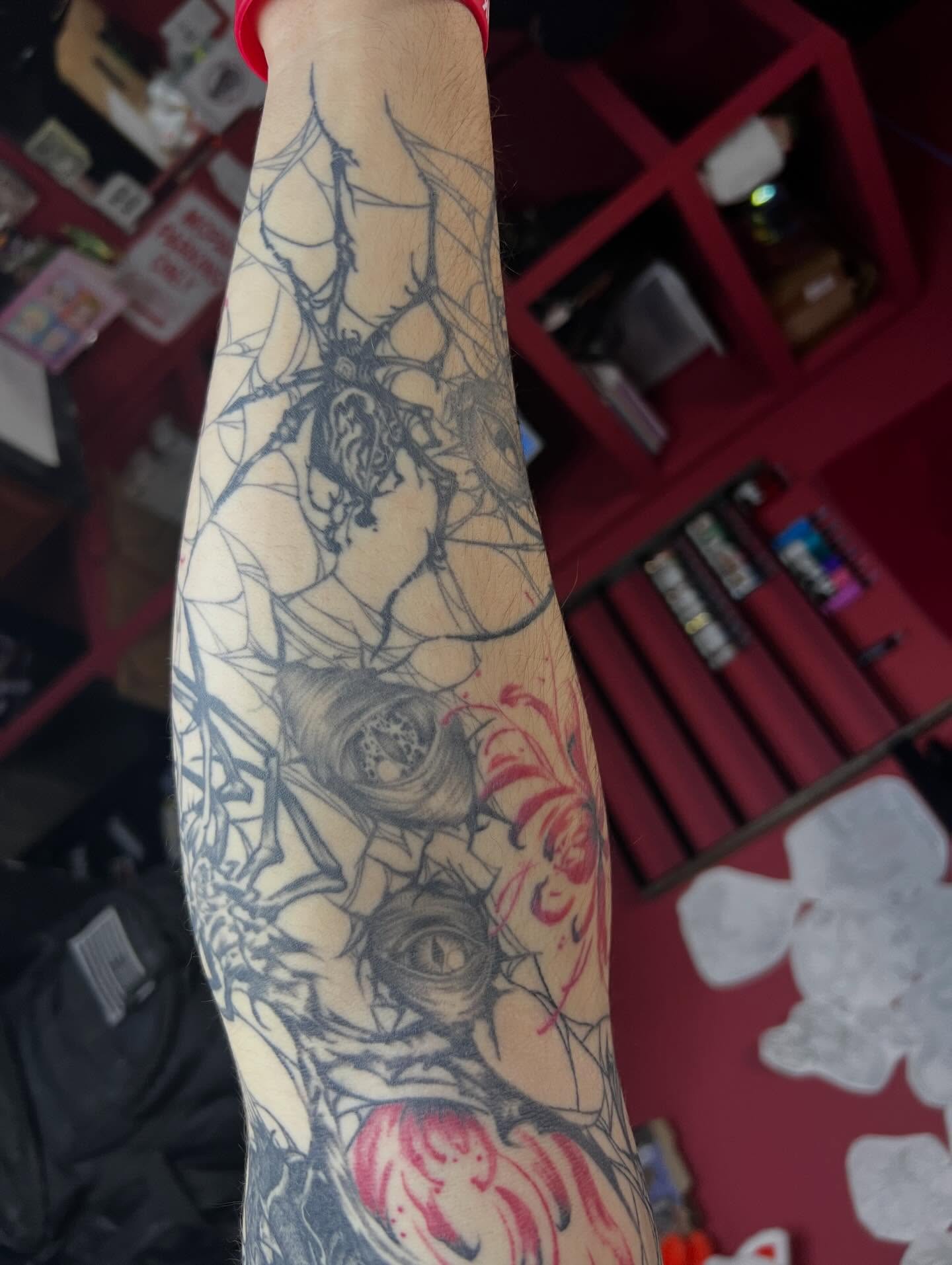 Spider web realism tattoo on the forearm by Dark Luna Tattoos LLC