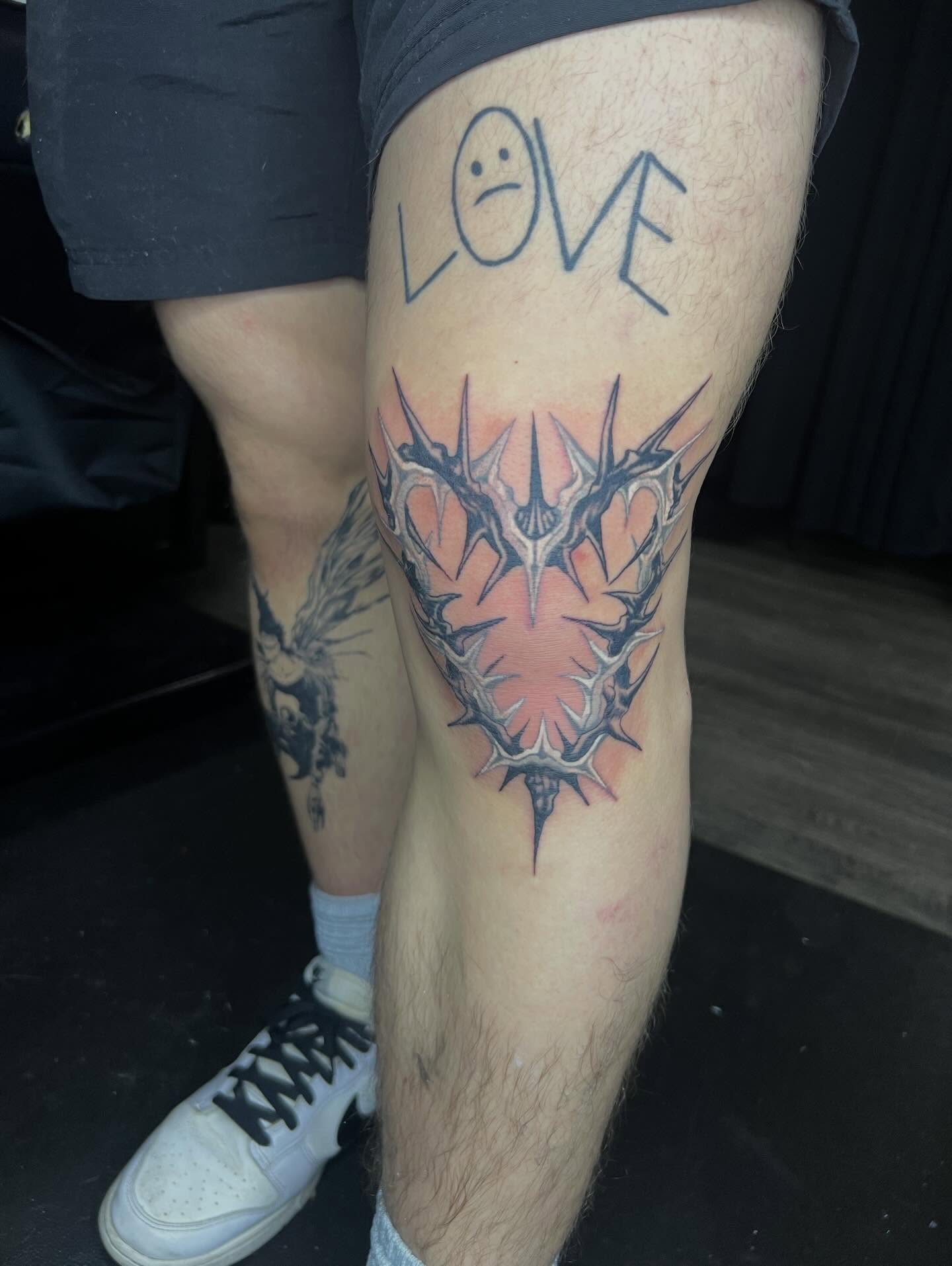 Thorn crown black and grey tattoo on the thigh by Dark Luna Tattoos LLC