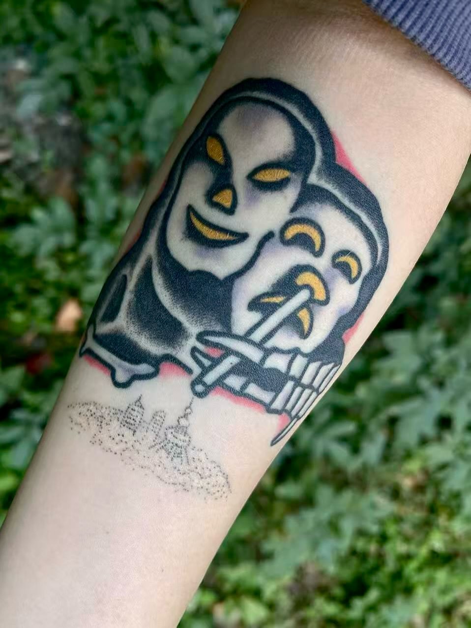 Ghost smoking cigarette American traditional tattoo on the forearm by JAX