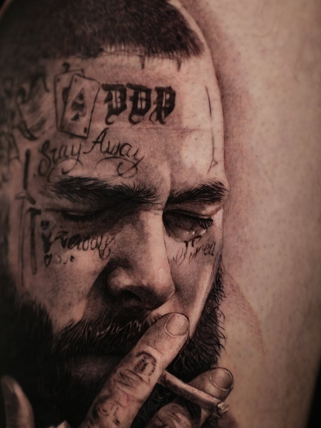 Portrait of a man smoking realism tattoo on the upper arm by J O S S I e L P I N e D A