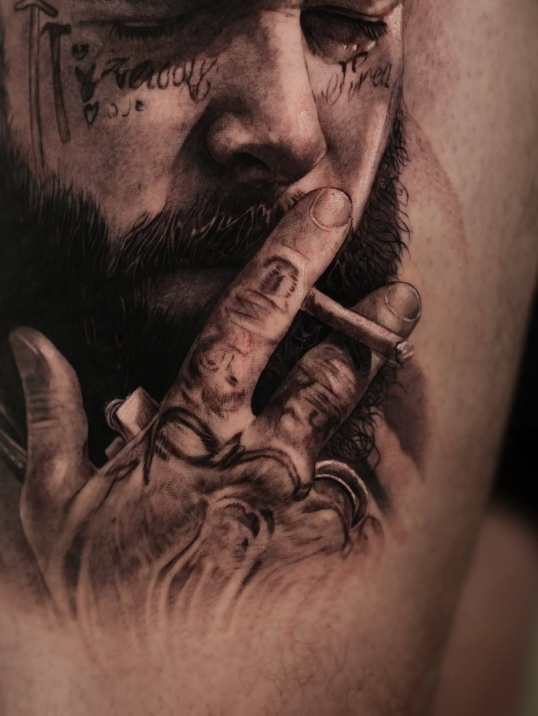 Portrait of a man smoking surrealism tattoo on the upper arm by J O S S I e L P I N e D A