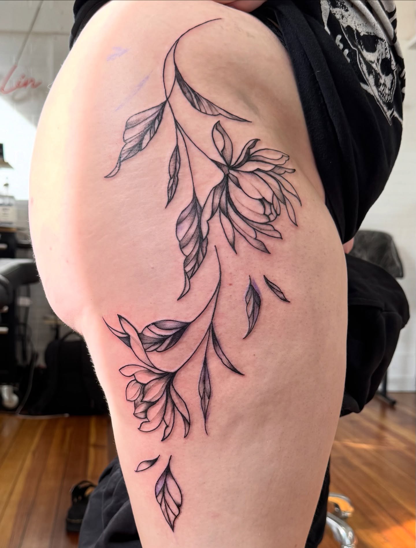 Willow branch black and grey tattoo on the thigh by Lindsay Shriver
