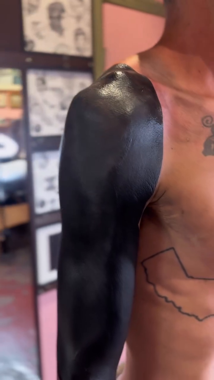 Full arm coverage blackwork tattoo by Storm Smith