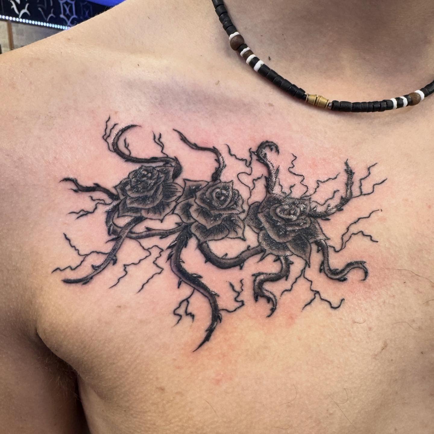 Roses and lightning realism tattoo on the chest by LeLe