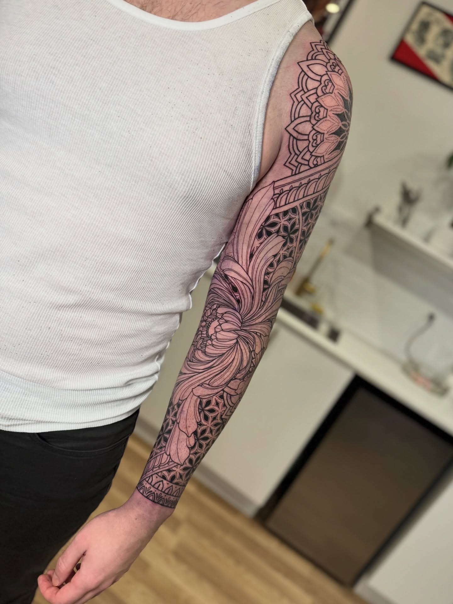 Floral mandala ornamental tattoo on the forearm by Laure Conzales