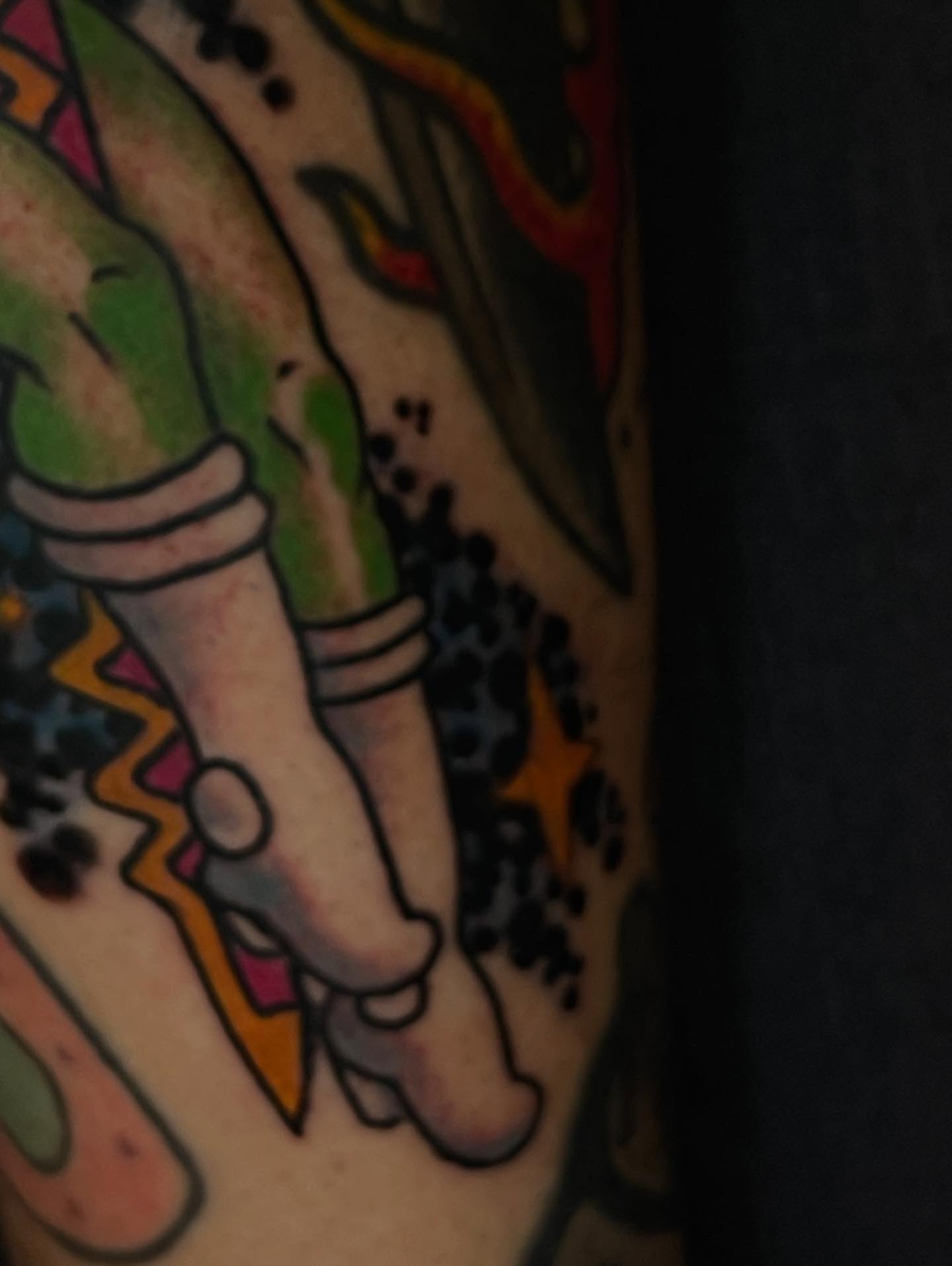 Feet with anklets American traditional tattoo on the forearm by Ian Bederman, Austin, Texas