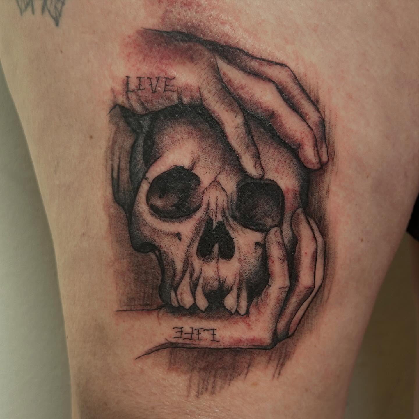 Skull and hands realism tattoo on the forearm by Raul Najera Tattoo, Plano, Texas