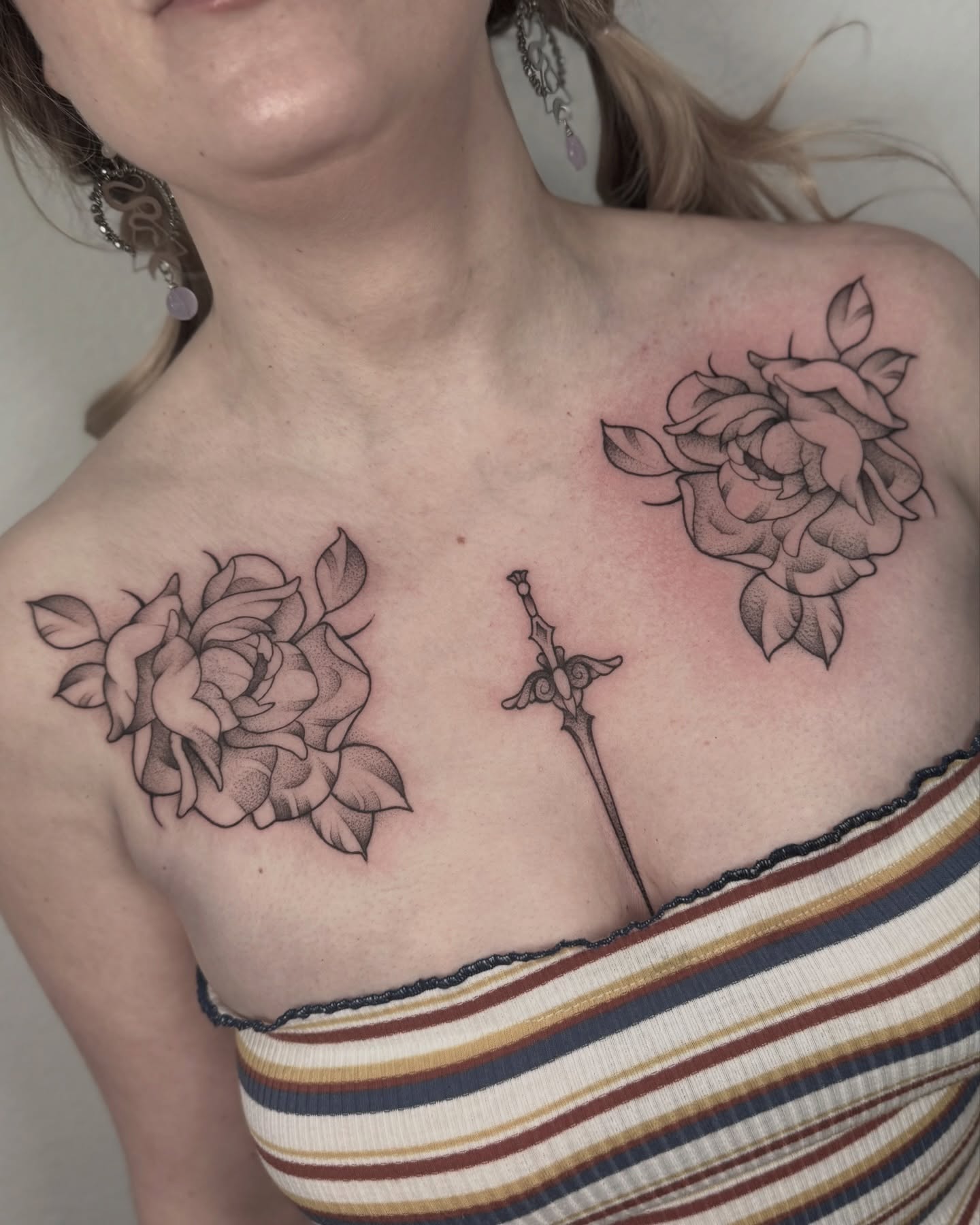 Roses and sword black and grey tattoo on the chest by Ally Ghastly, Eugene, Oregon