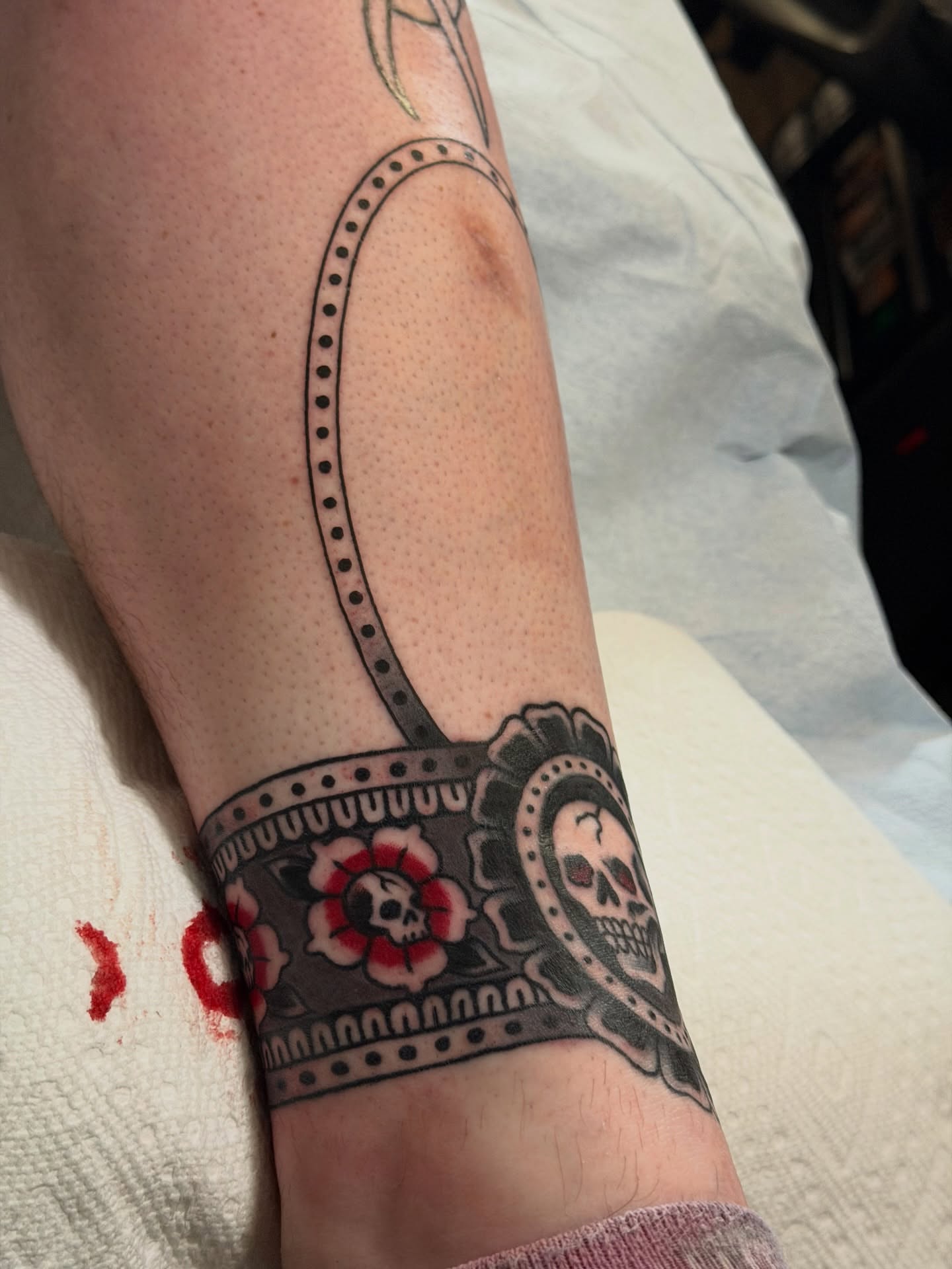 Sugar skull Chicano tattoo on the forearm by Brandon Bear