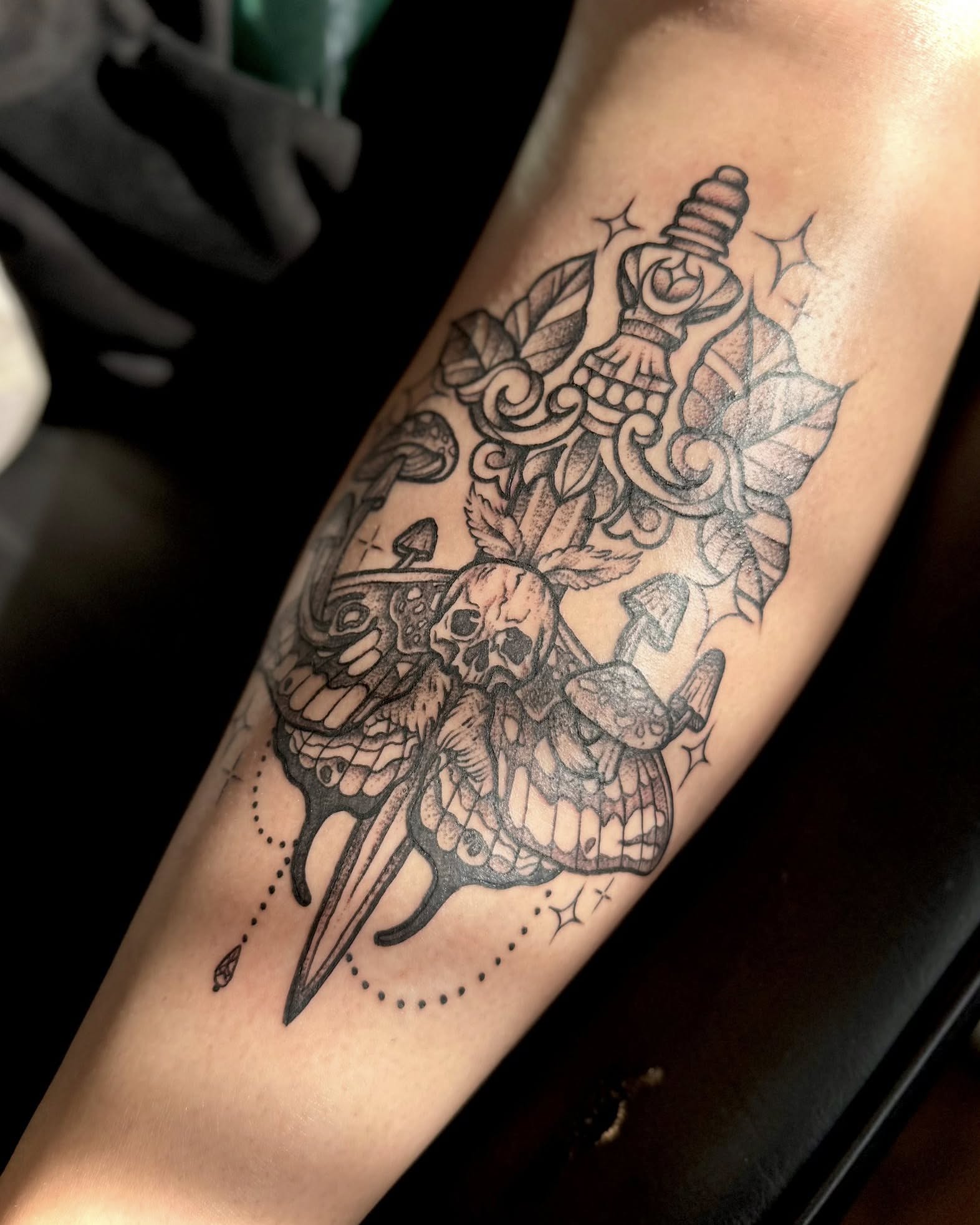Skull and dagger dotwork tattoo on the forearm by Eden Rose, Kalama, Washington