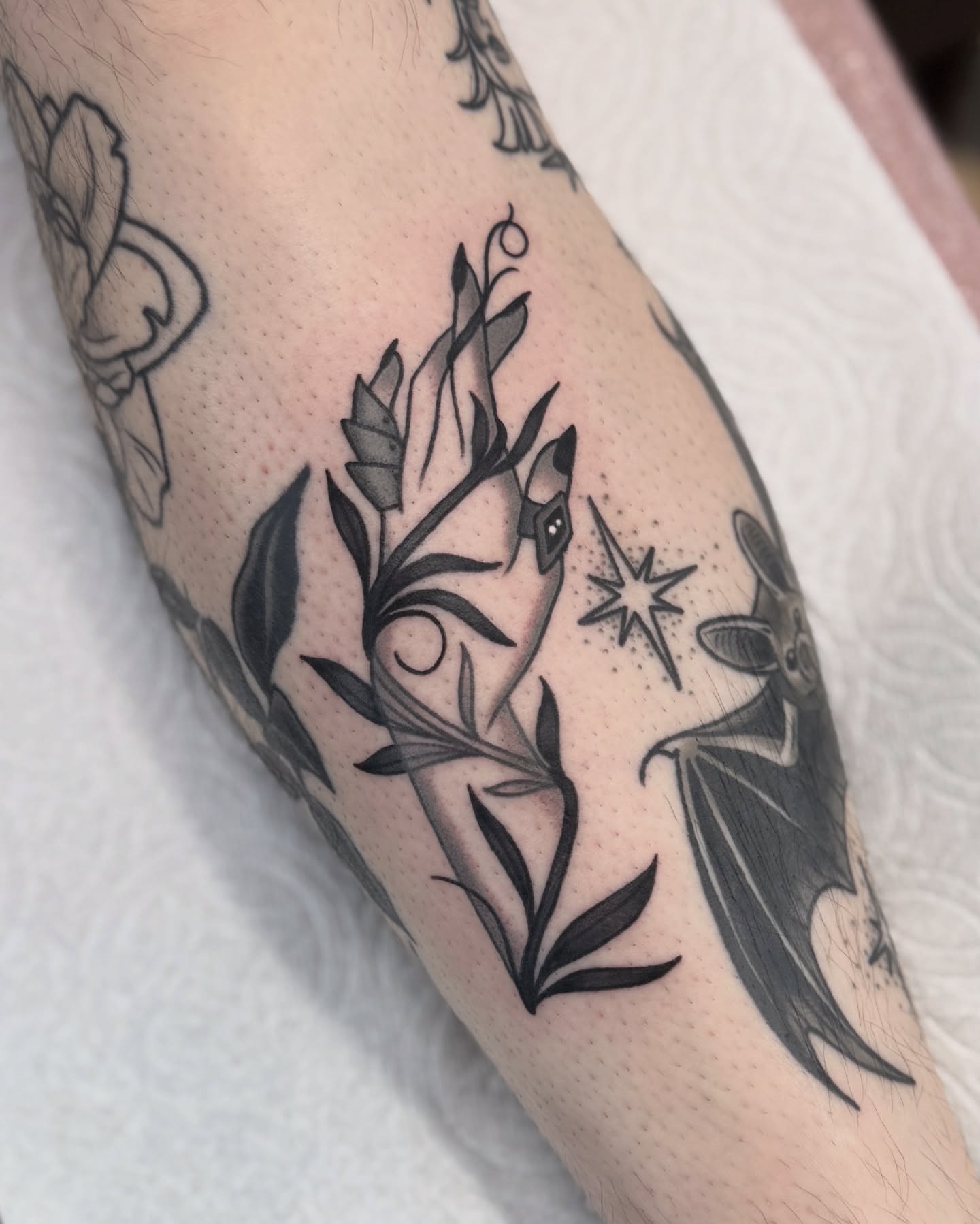 Botanical and celestial dotwork tattoo on the forearm by Nia (Knee-uhh) 🦷