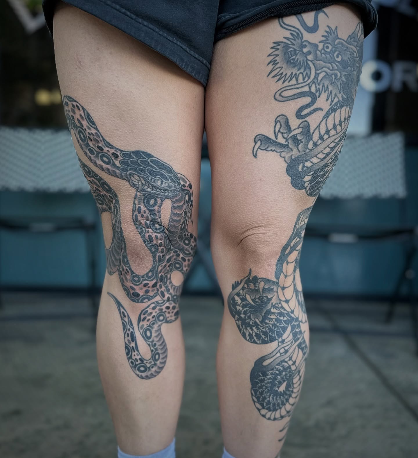 Snake and dragon japanese irezumi tattoo on the thigh by Walk-in American Traditional Tattoos Las