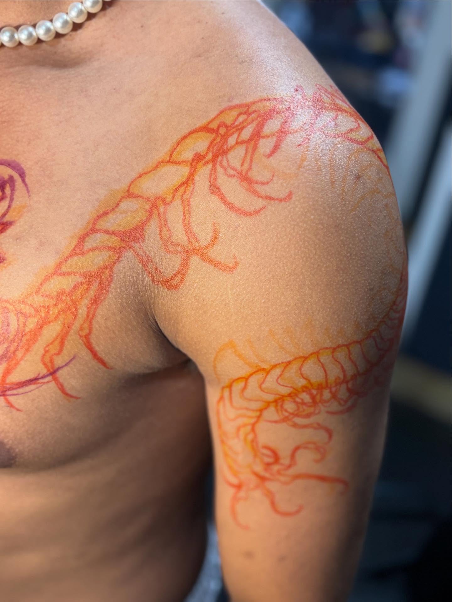 Dragon dotwork tattoo on the shoulder by Slade Nowicki