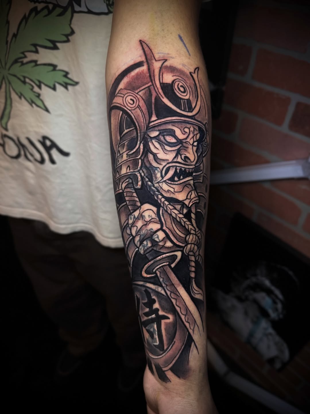 Samurai mask and sword realism tattoo on the forearm by Andres Calvo🇺🇸🇨🇴