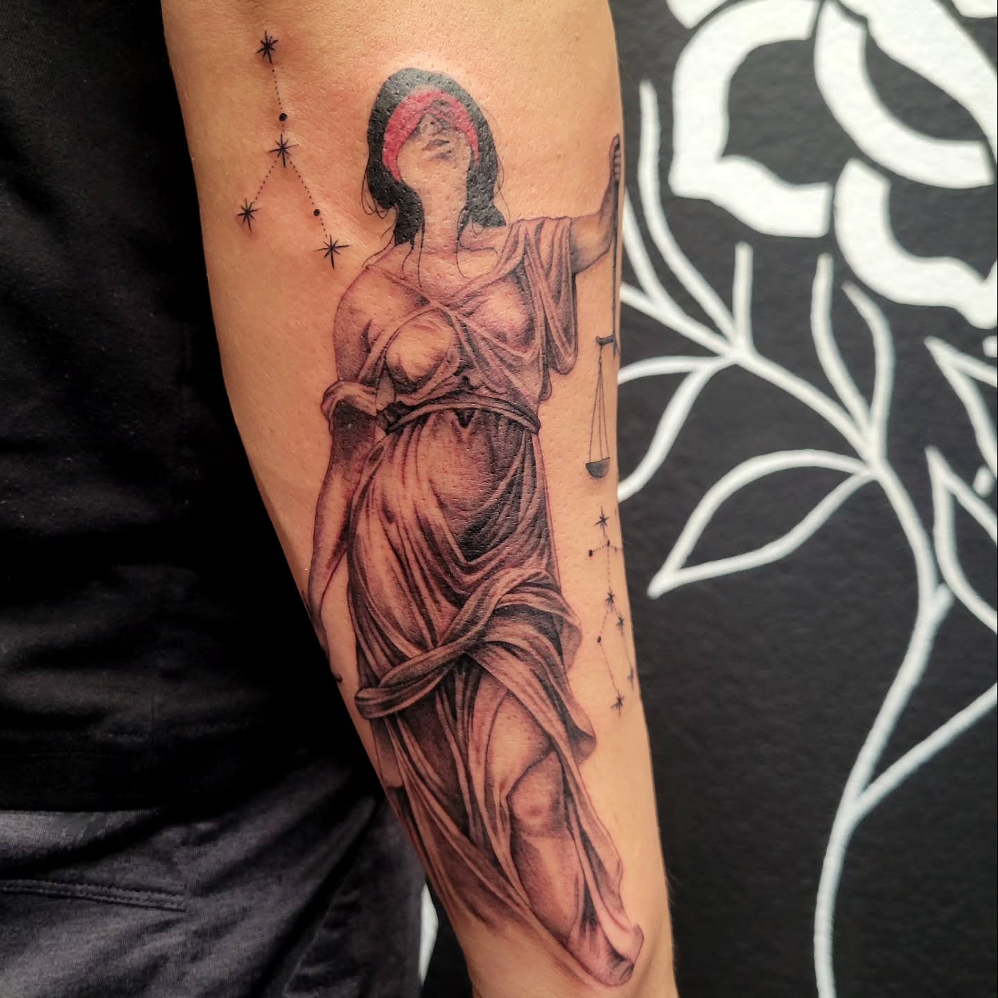 Statue of lady justice realism tattoo on the forearm by Marina Cobb