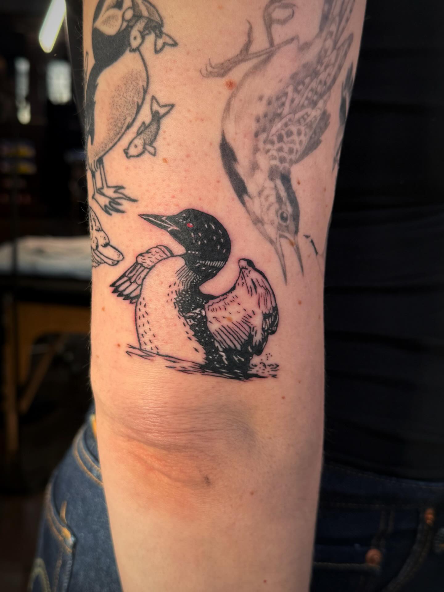 Loon black and grey tattoo on the forearm by Luna Enriquez⚡️, Portland, Oregon
