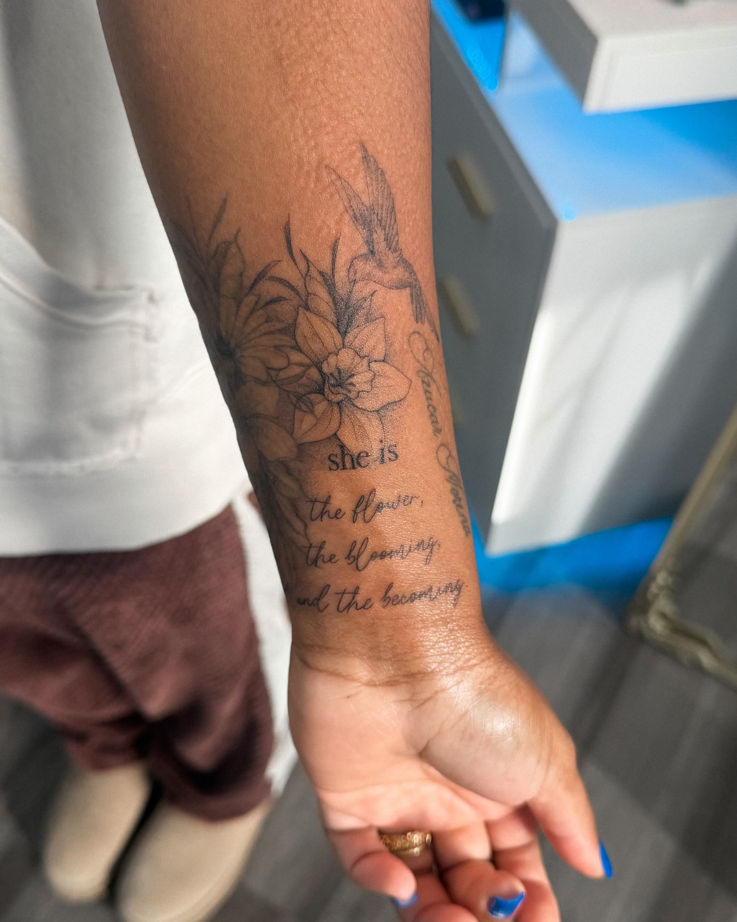 Flower and hummingbird black and grey tattoo on the forearm by Daniel Montoya, Charlotte, North Carolina