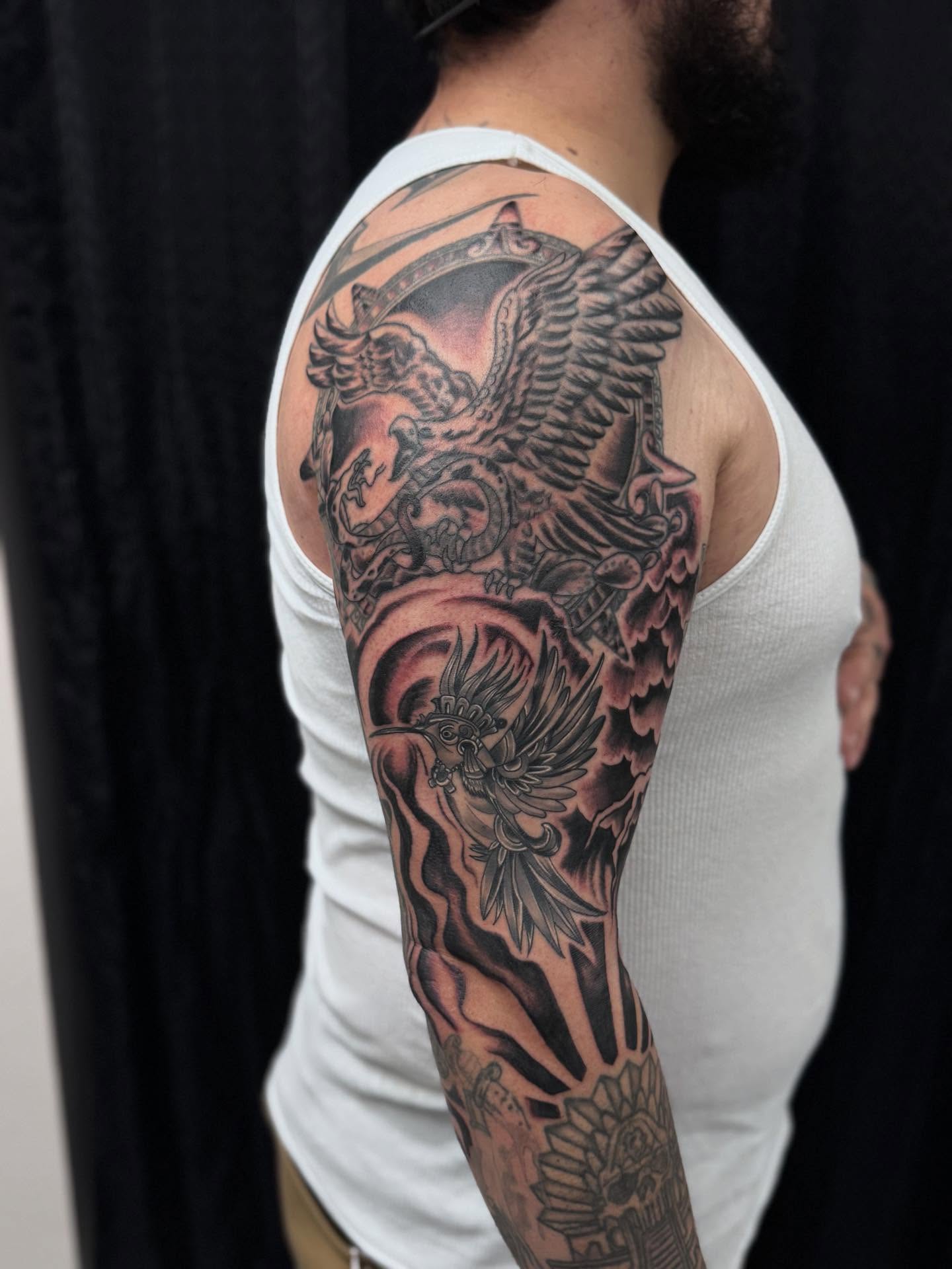 Mythical creature realism tattoo on the upper arm by Jacob - Tattoo Artist