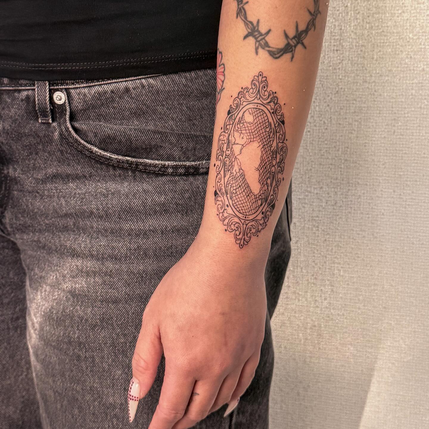 Portrait black and grey tattoo on the forearm by Las Vegas Tattoo Artist