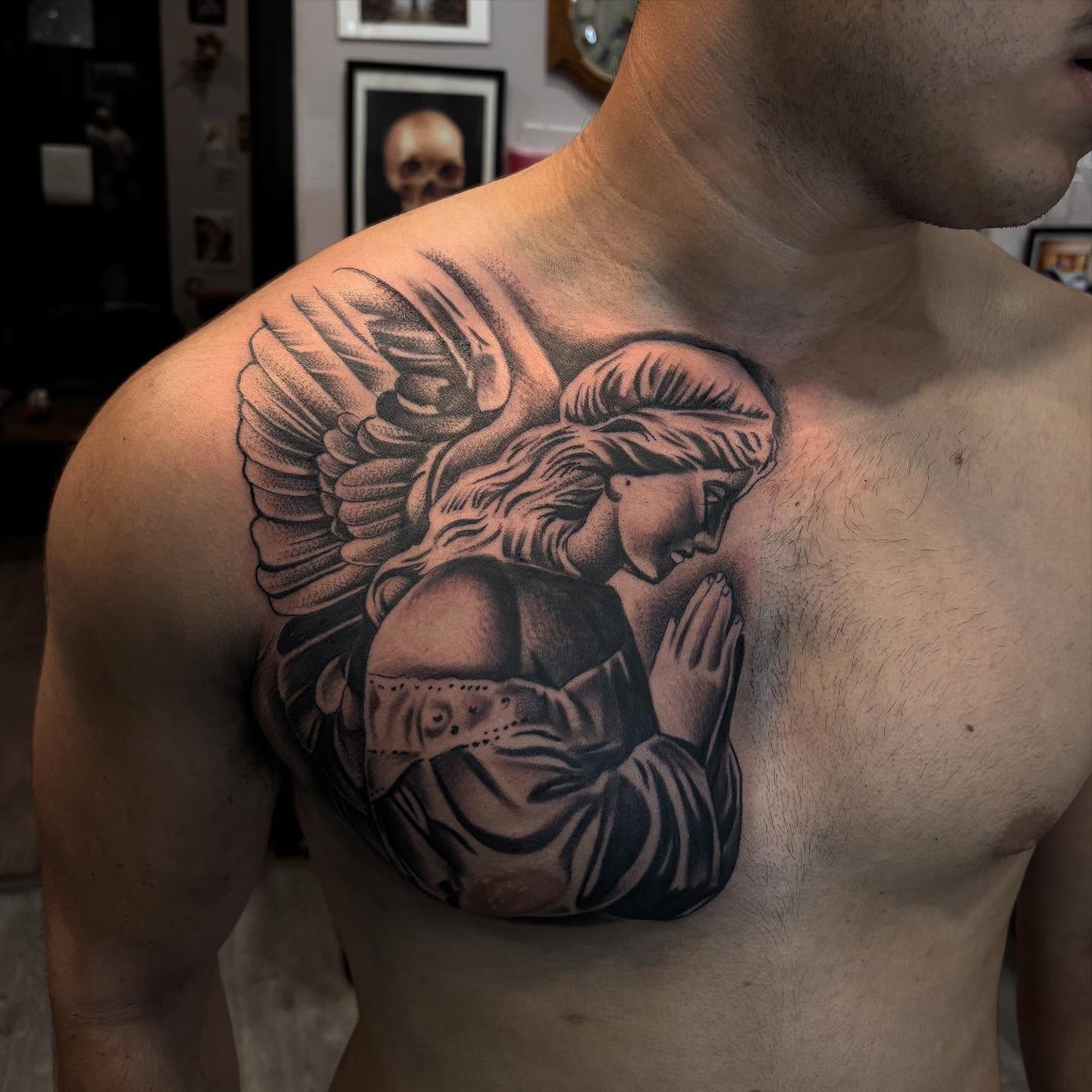 Angel and man realism tattoo on the chest by michael