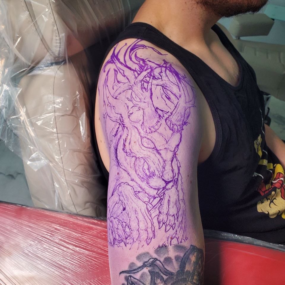 Dragon dotwork tattoo on the upper arm by Matthew Ray, Harrisburg, North Carolina