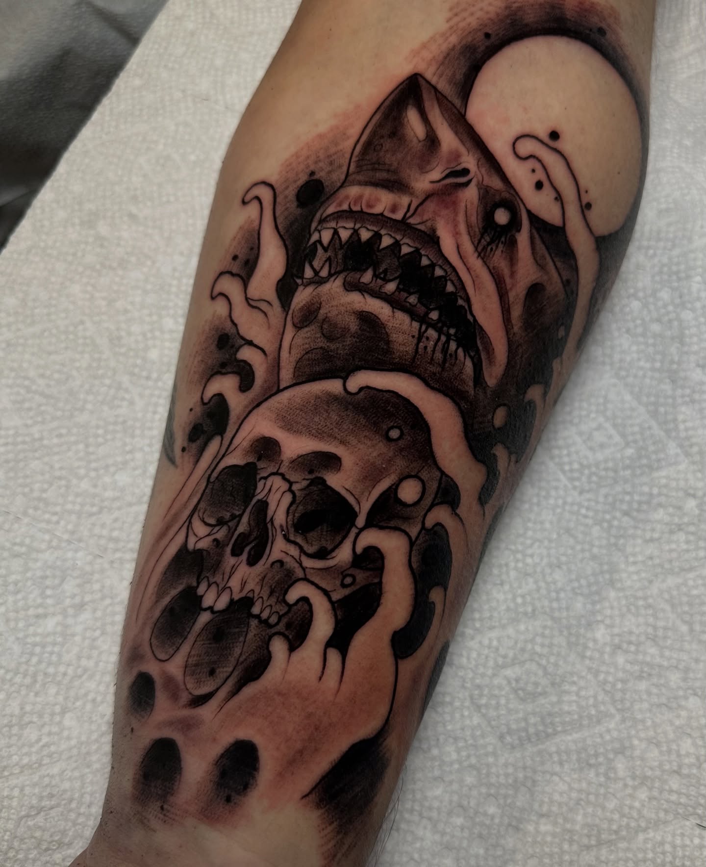 Shark and skull dark realism tattoo on the forearm by 𝐀𝐮𝐬𝐭𝐢𝐧 𝐌𝐨𝐫𝐫𝐢𝐬𝐨𝐧 𝐓𝐚𝐭𝐭𝐨𝐨𝐬