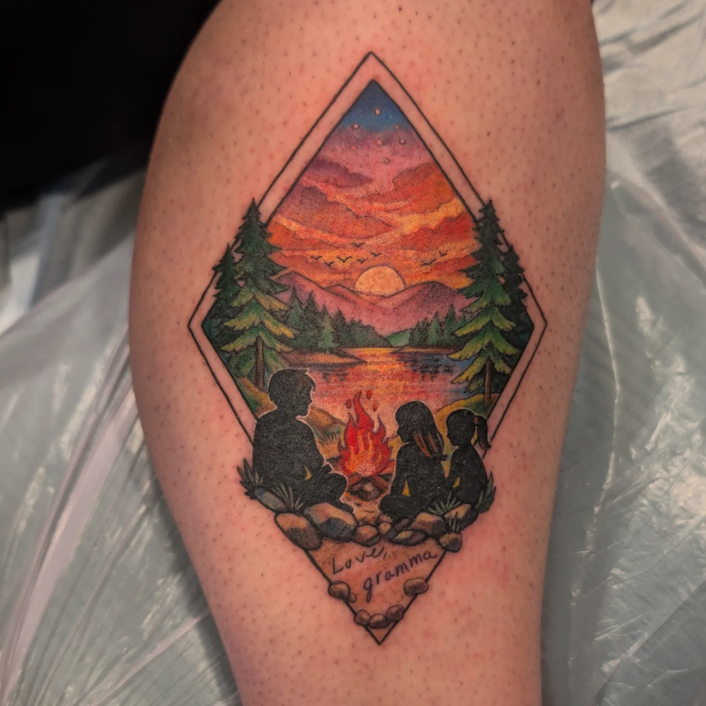 Campfire scene geometric tattoo on the thigh by 💎 Neon