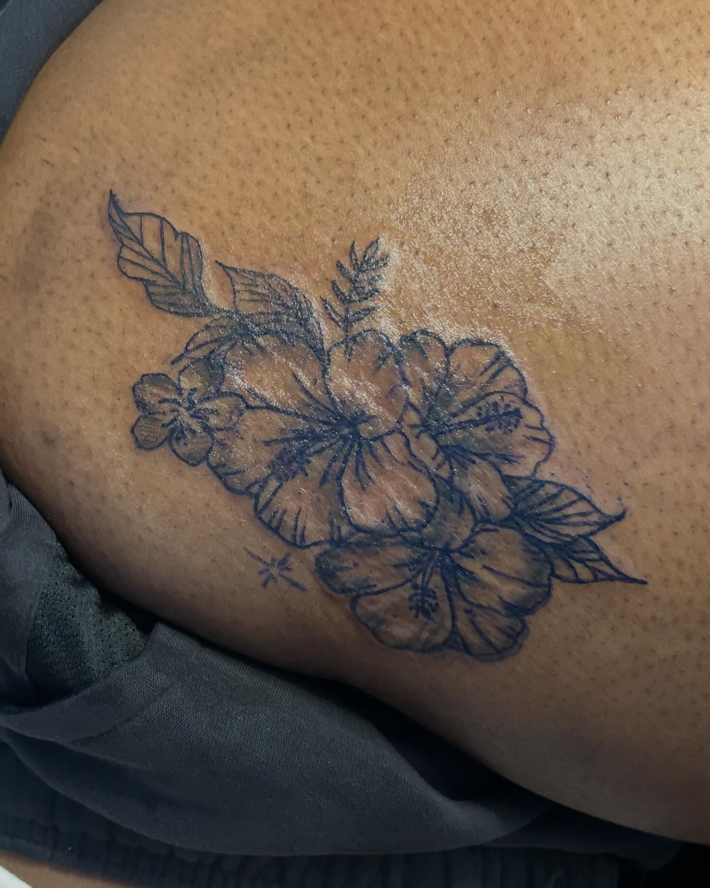 Hibiscus flowers black and grey tattoo on the thigh by Jae the artist🫡