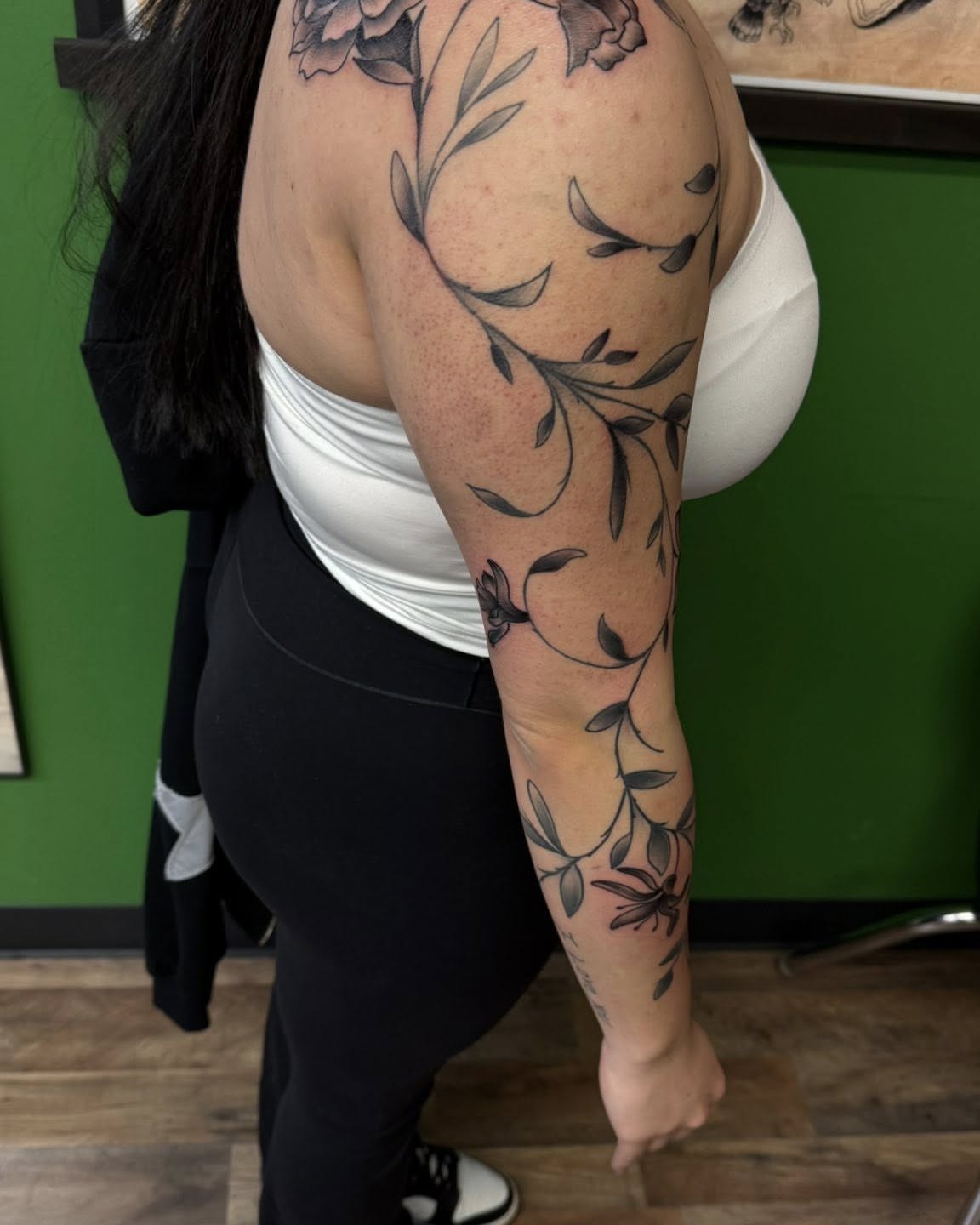 Floral vine black and grey tattoo on the upper arm by Josh Roberts, Franklin, Ohio
