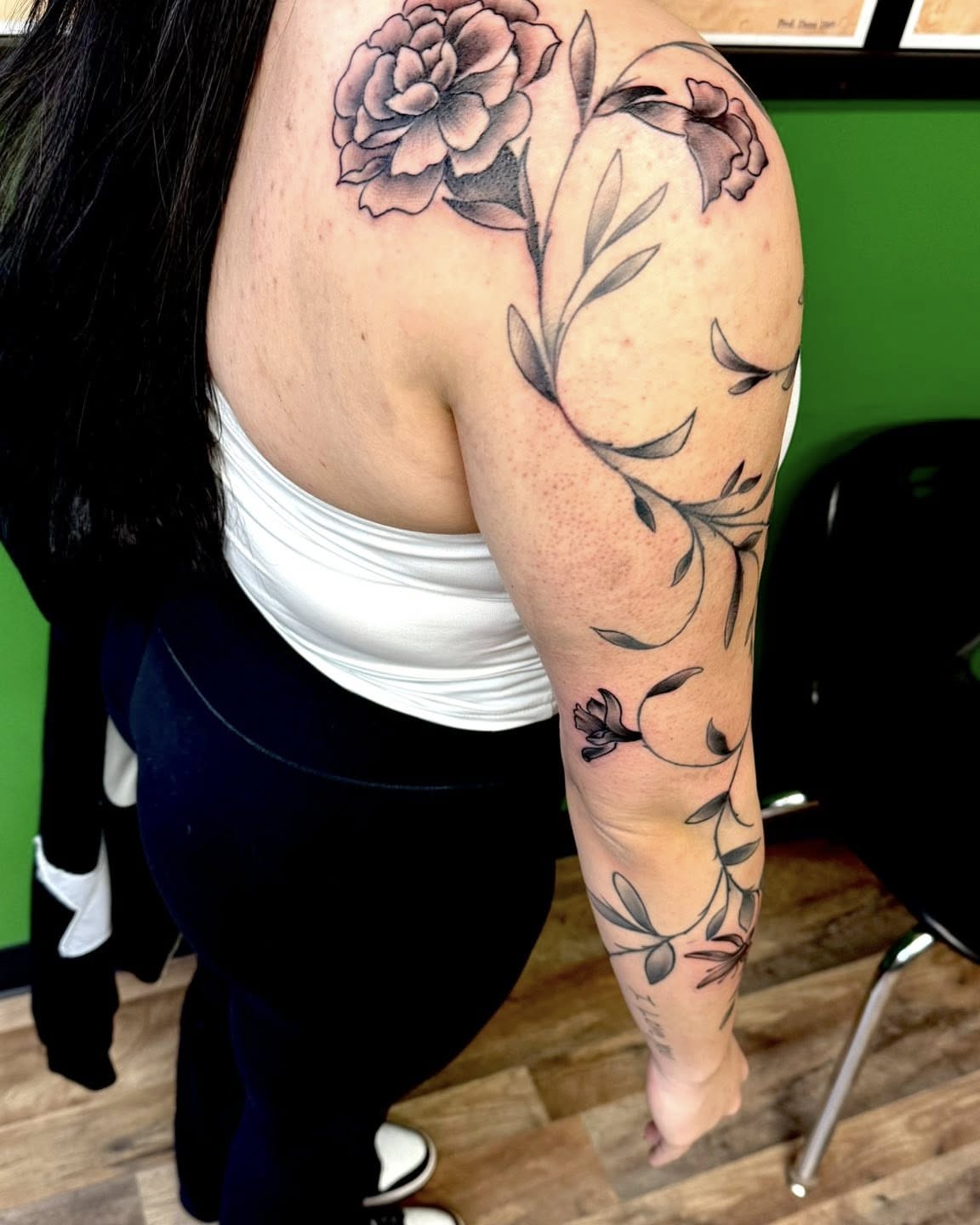 Floral design black and grey tattoo on the upper arm by Josh Roberts, Franklin, Ohio